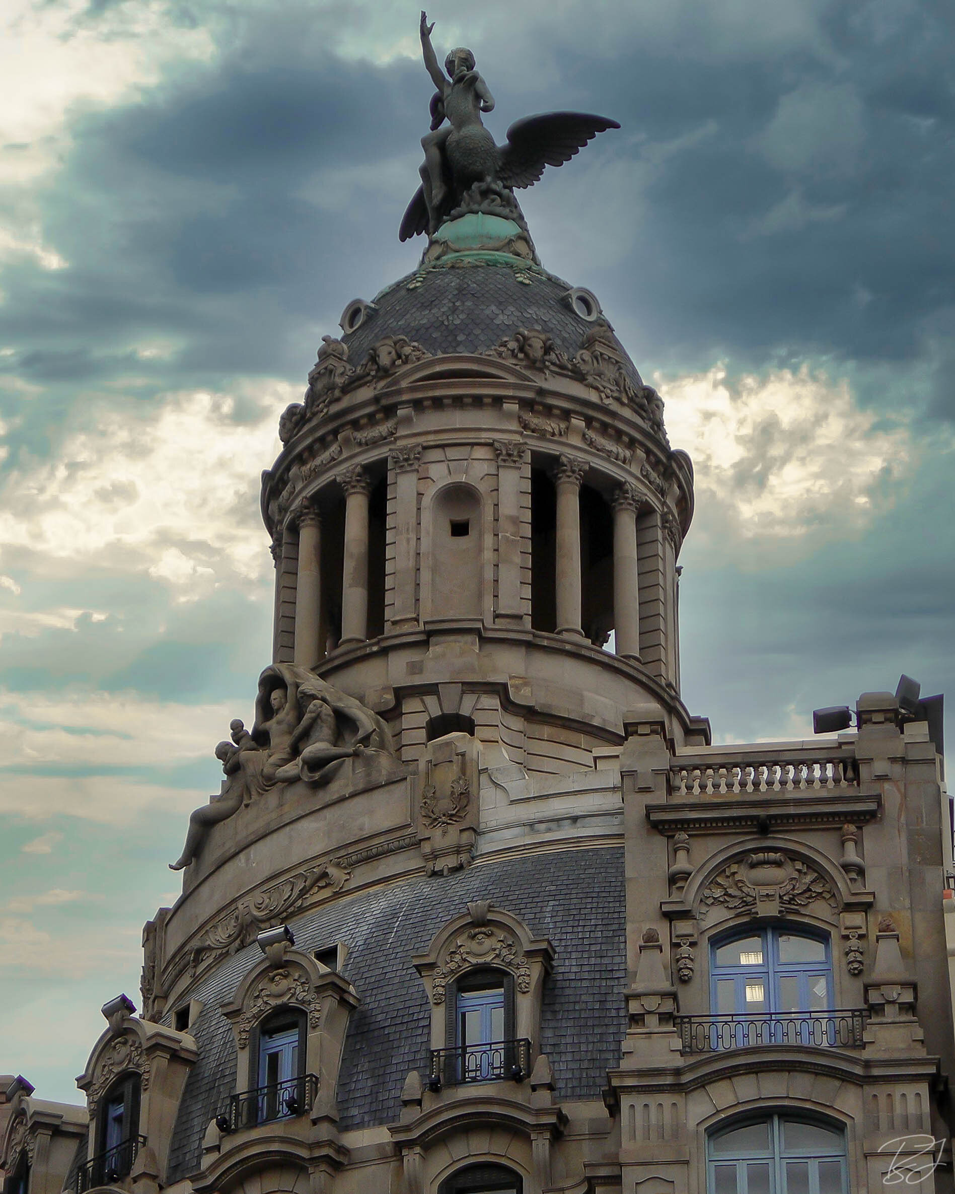 Building dome with sculptures, Barcelona, Spain.