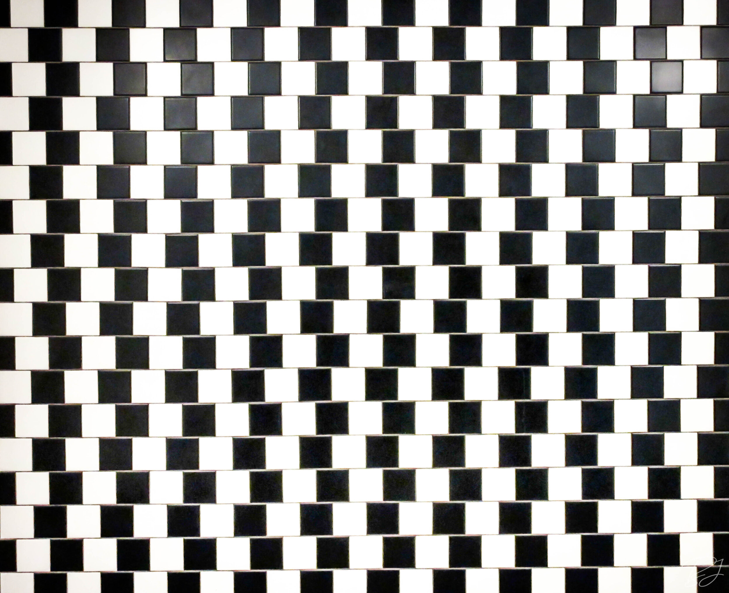 Black and white tile pattern at the Exploritorium, San Francisco, California.