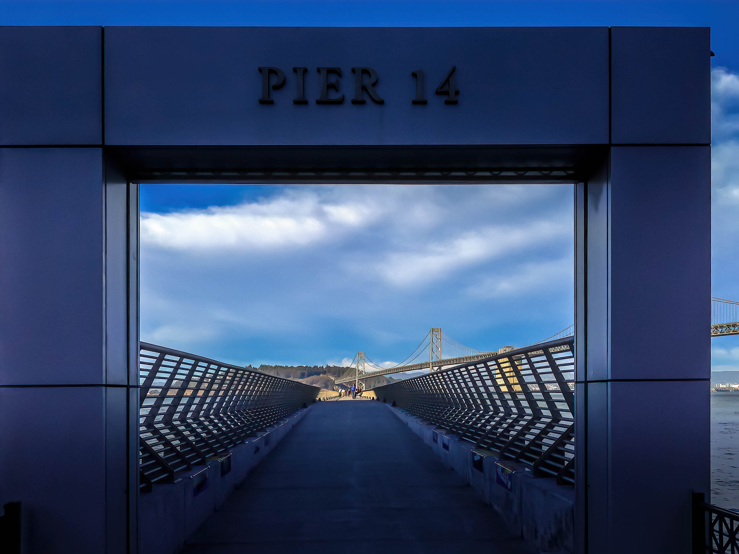 Pier 14 looking out to Yerba Buena Island and San Francisco Bay Bridge, San Francisco, California.