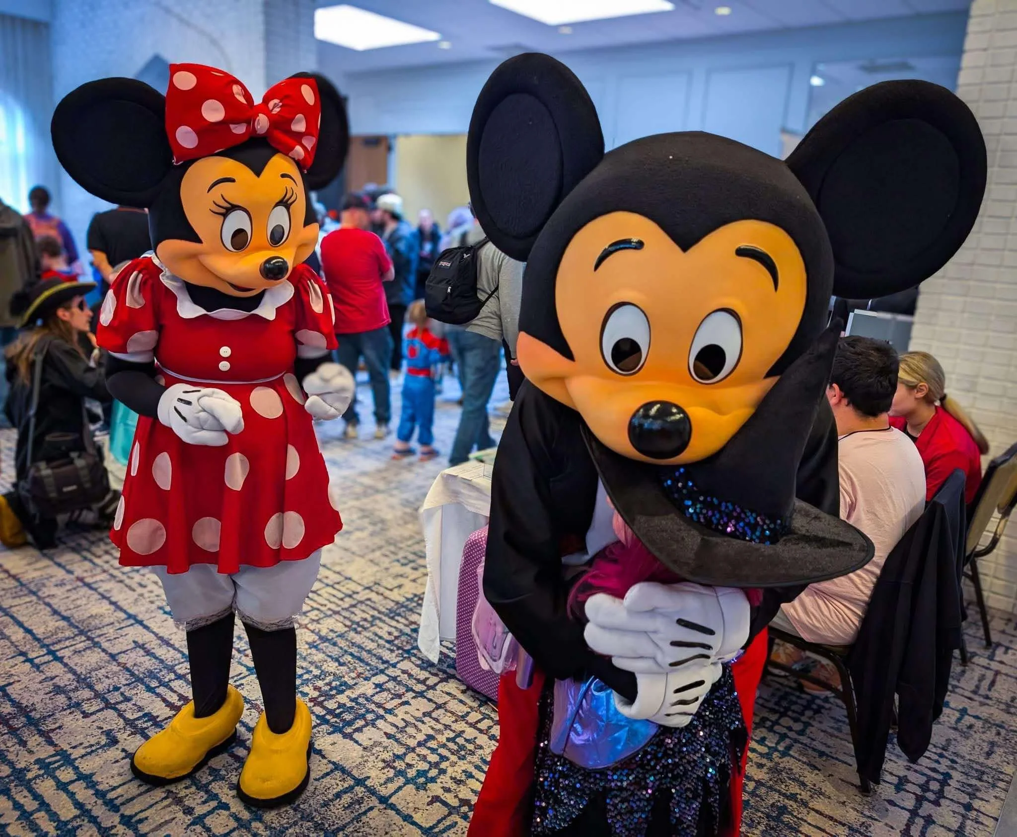 Mr and Miss Mouse party characters at an event.