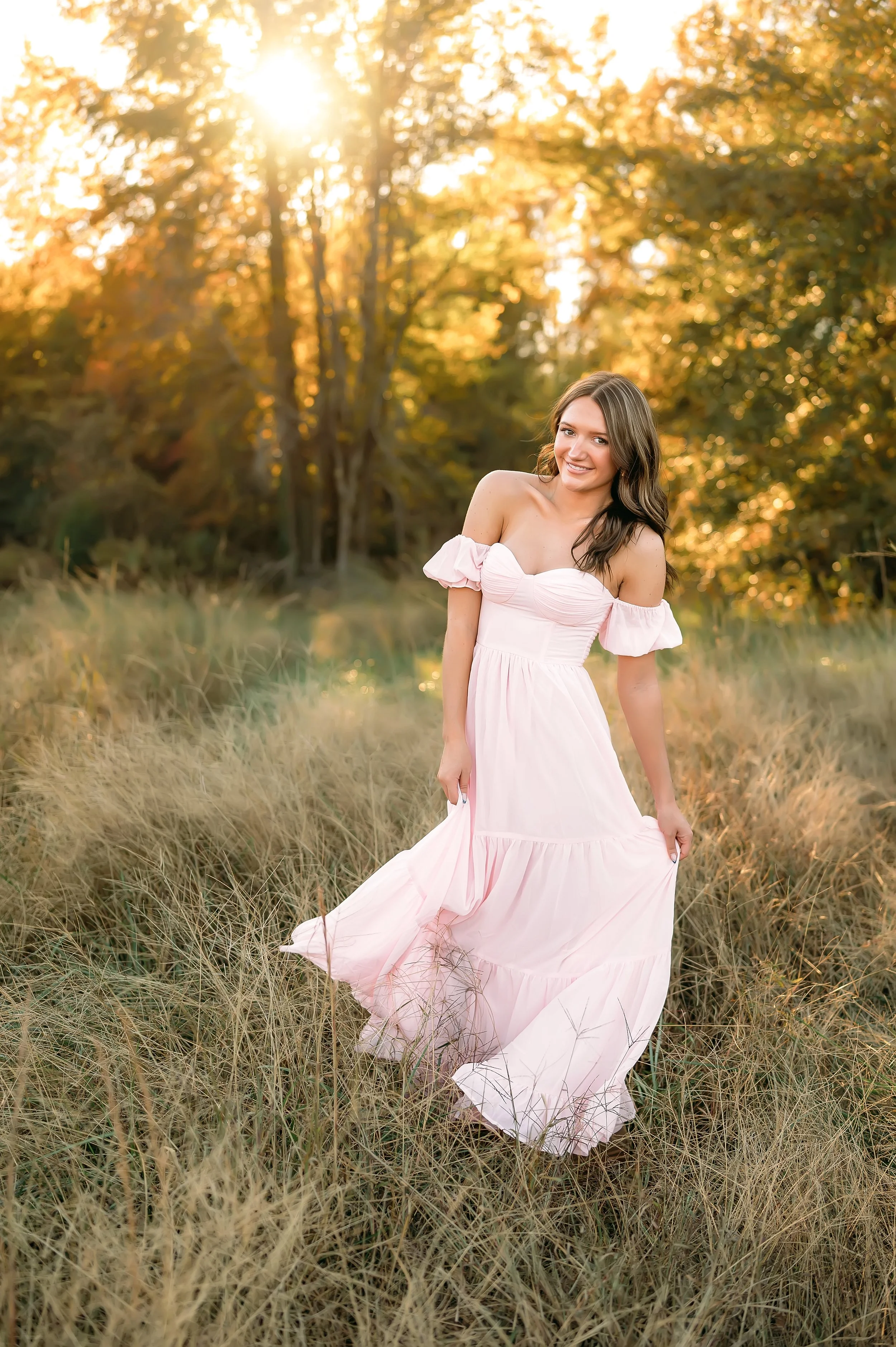 high school senior photo, tall grassy fields at golden hour and flowy dress, ethereal