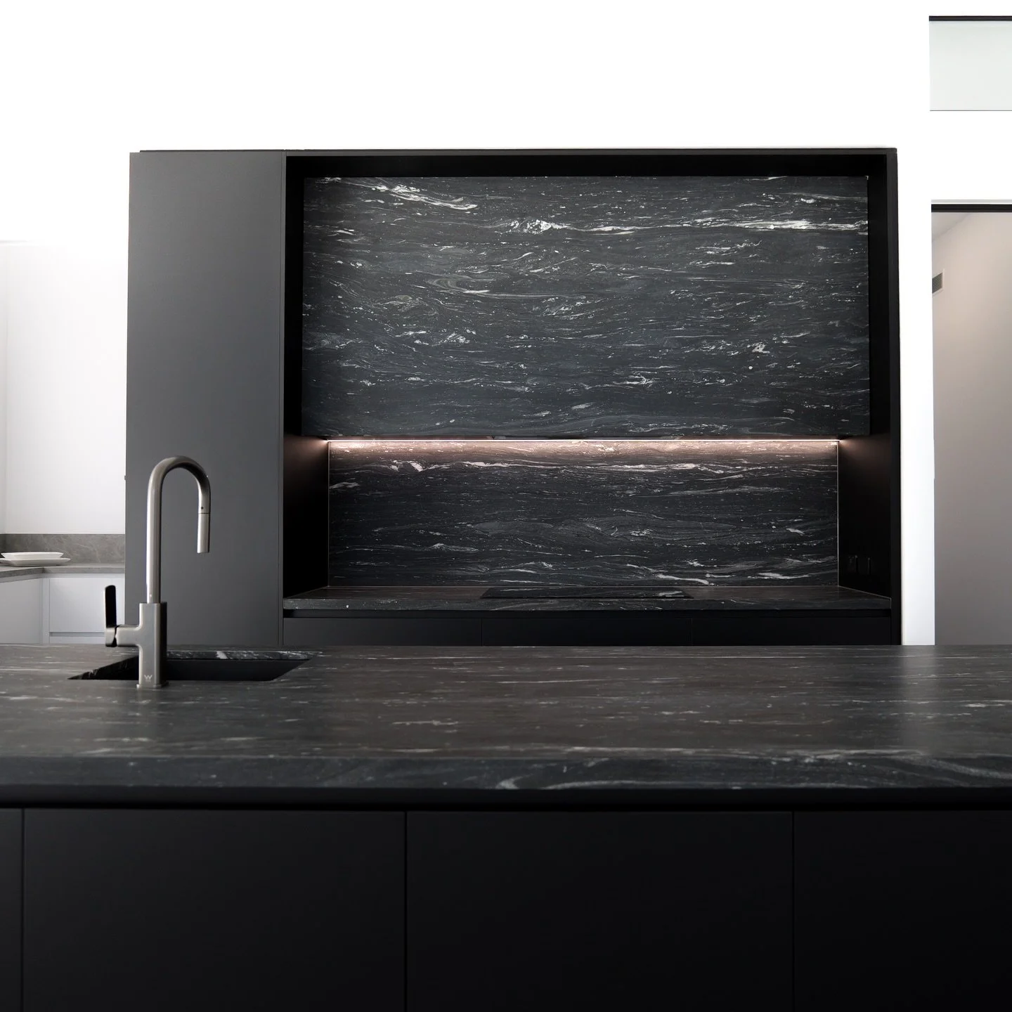 This kitchen features Makalu Granite benchtops, expertly fabricated to highlight the stone&rsquo;s natural movement while delivering a strong, sculptural finish. 

The softened arris profile adds refinement, letting the island and splashback make a b