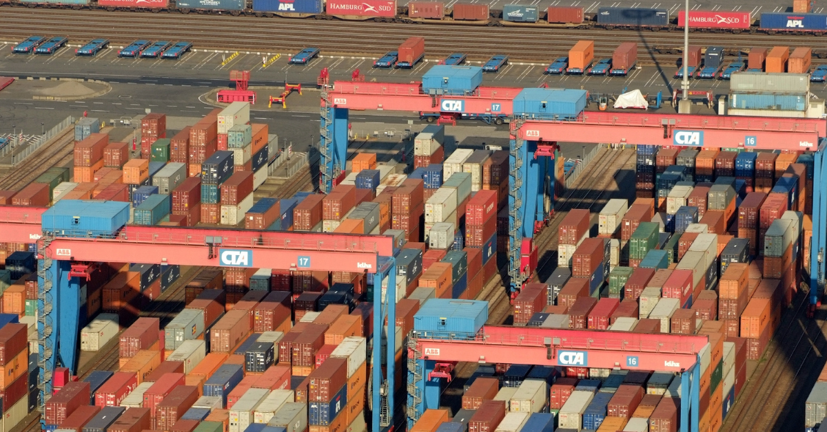 Illustration of stacked cargo containers at a freight terminal. Credit: Photo: Martina Nolte, Licence: CC BY-SA 3.0/de, via Wikimedia Commons