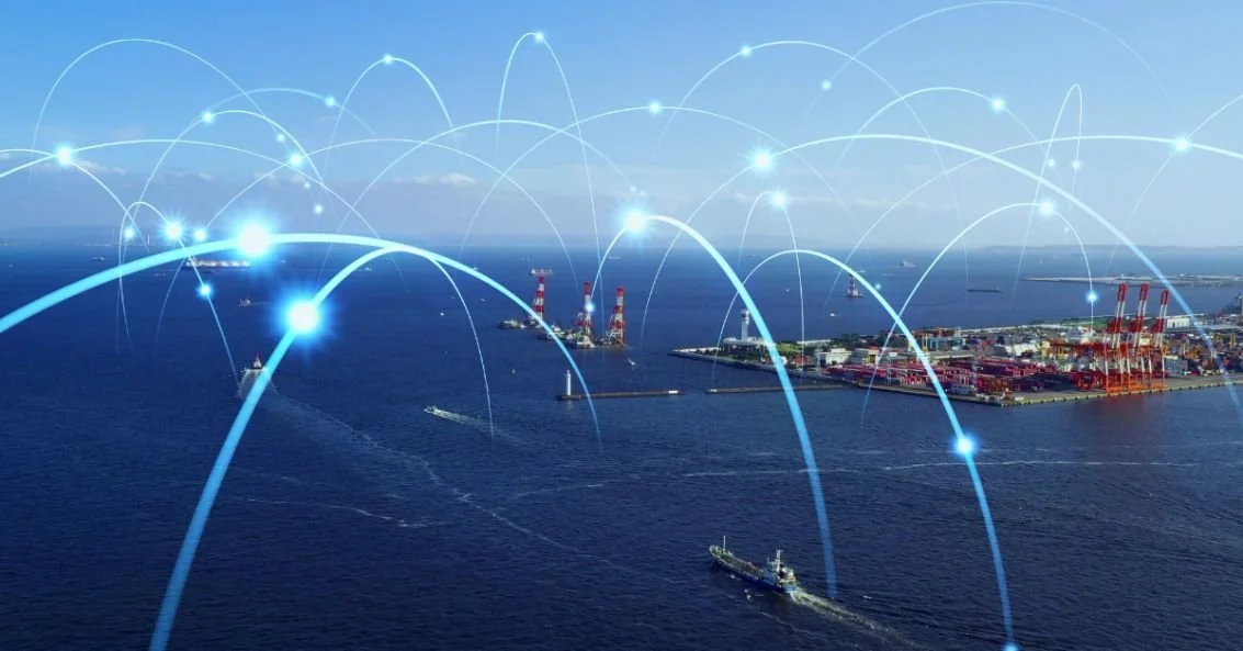 Ships and communication network concept with maritime traffic near port infrastructure. Source: iStock