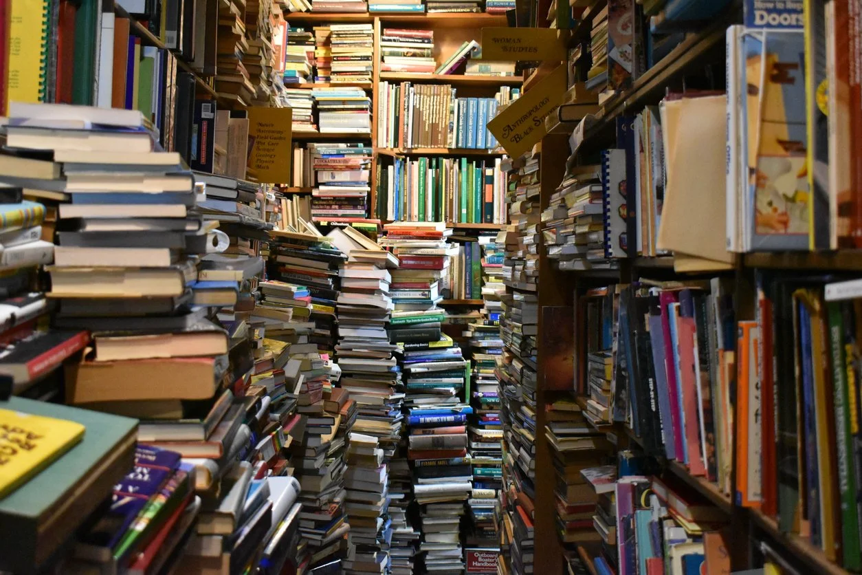 Piles of books in a used book store