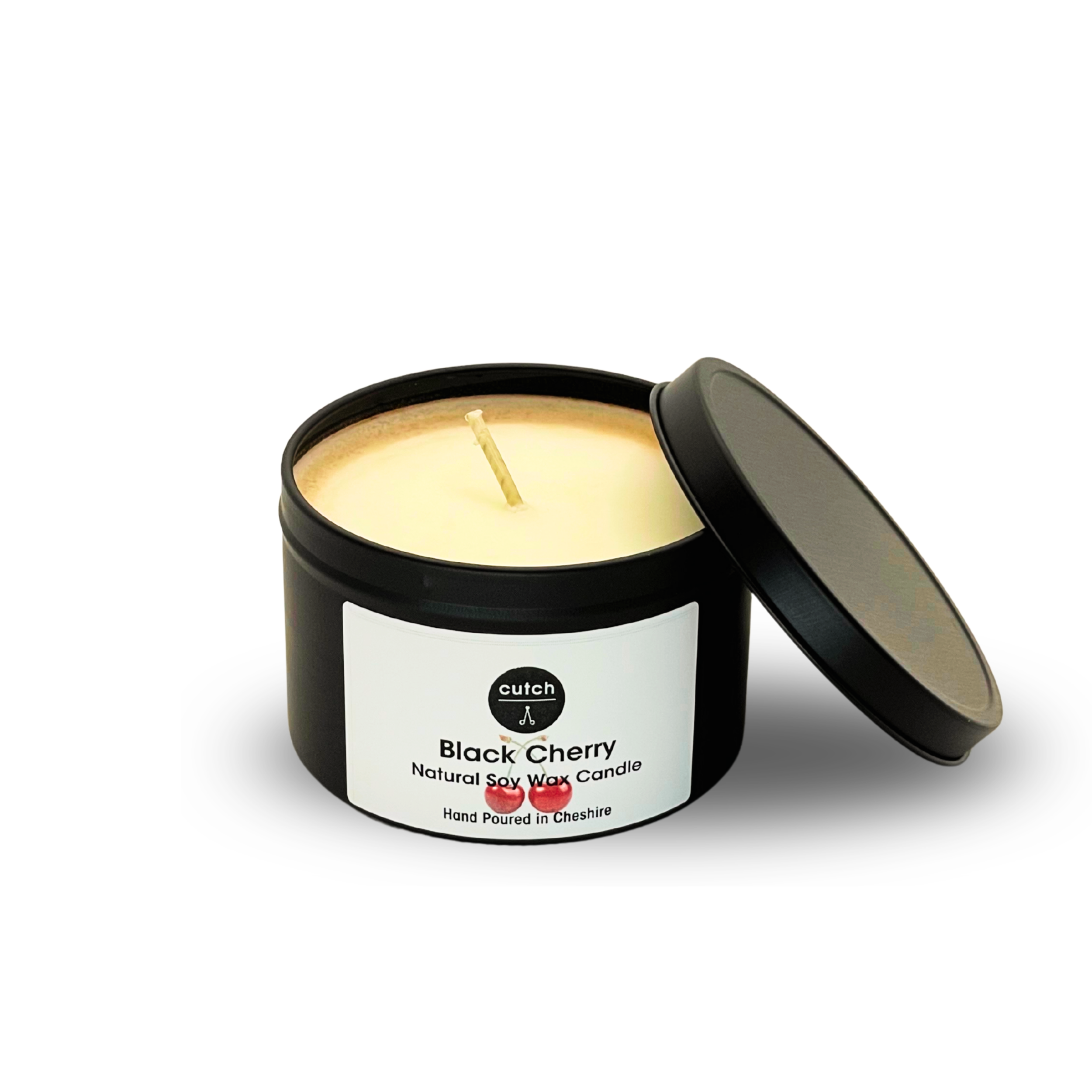 Black Cherry candle tin with lid leaning.png