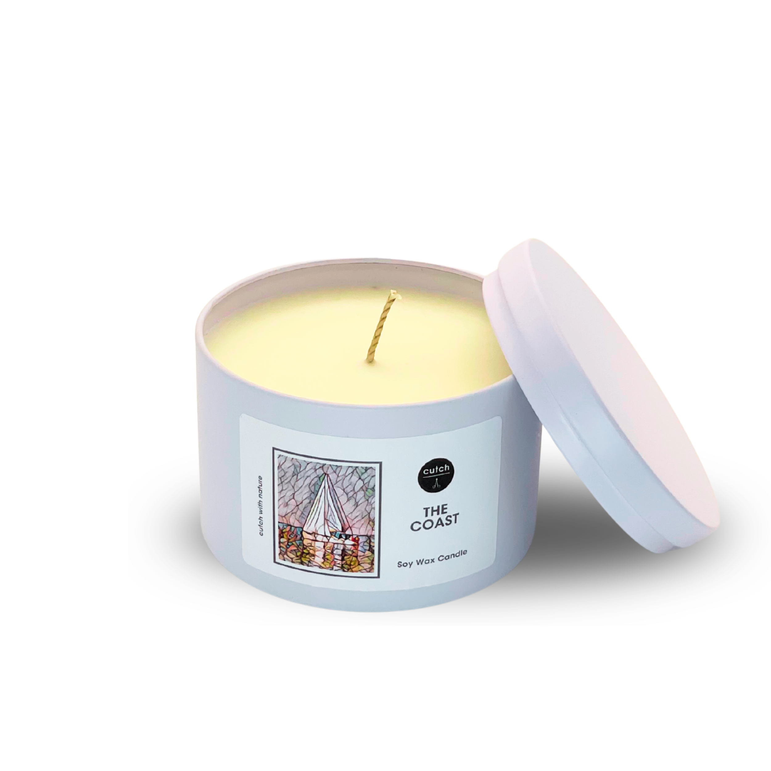 The Coast candle tin with lid leaning.png