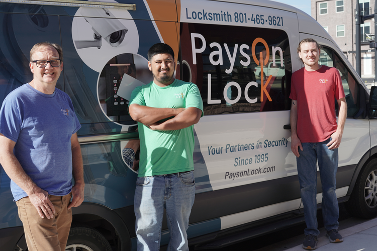 Payson Lock & Key locksmiths standing by mobile vehicle in Utah.