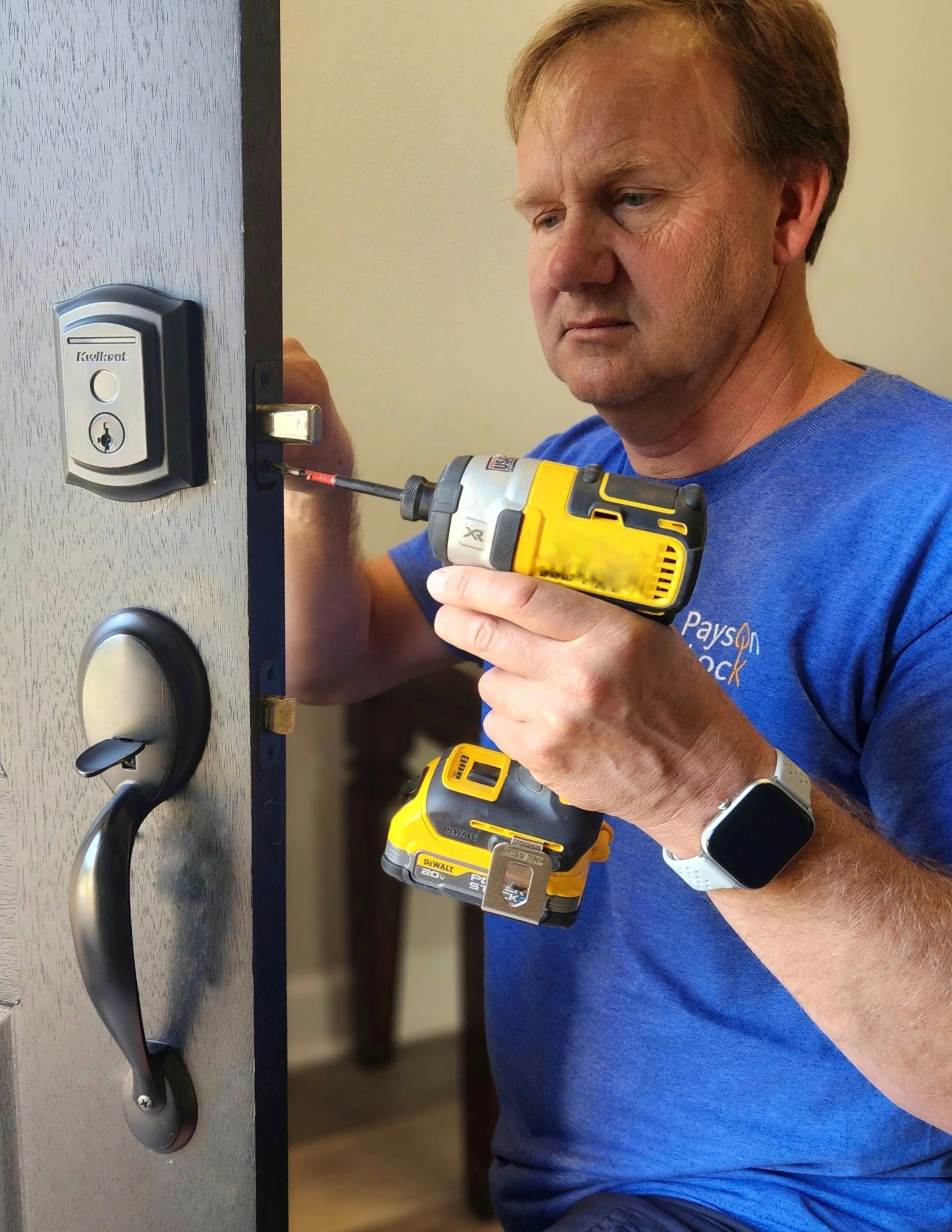 Locksmith installing a smart deadbolt