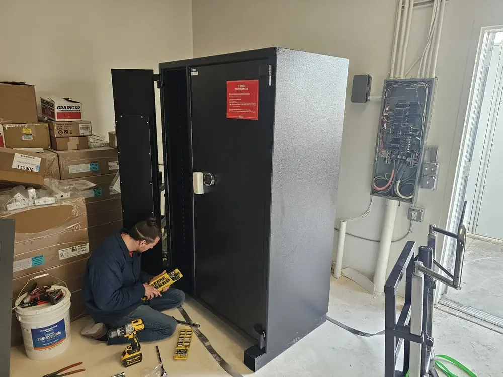 Payson Lock & Key locksmith repairing a safe at a customer's workplace in Utah.