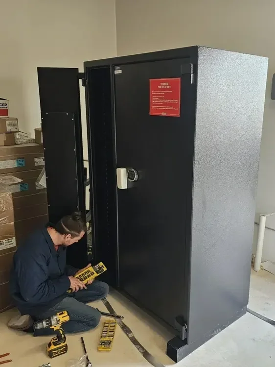 A Provo locksmith repairing a safe for a business.