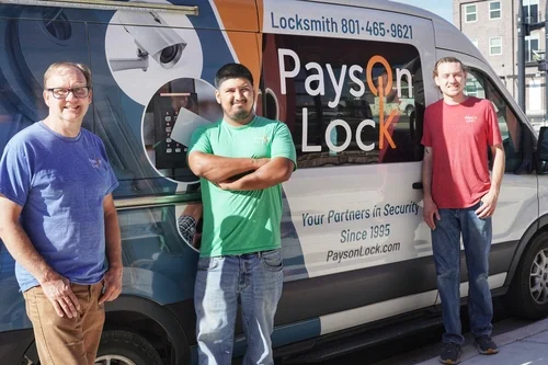 Locksmiths standing by Payson Lock & Key van in Utah.