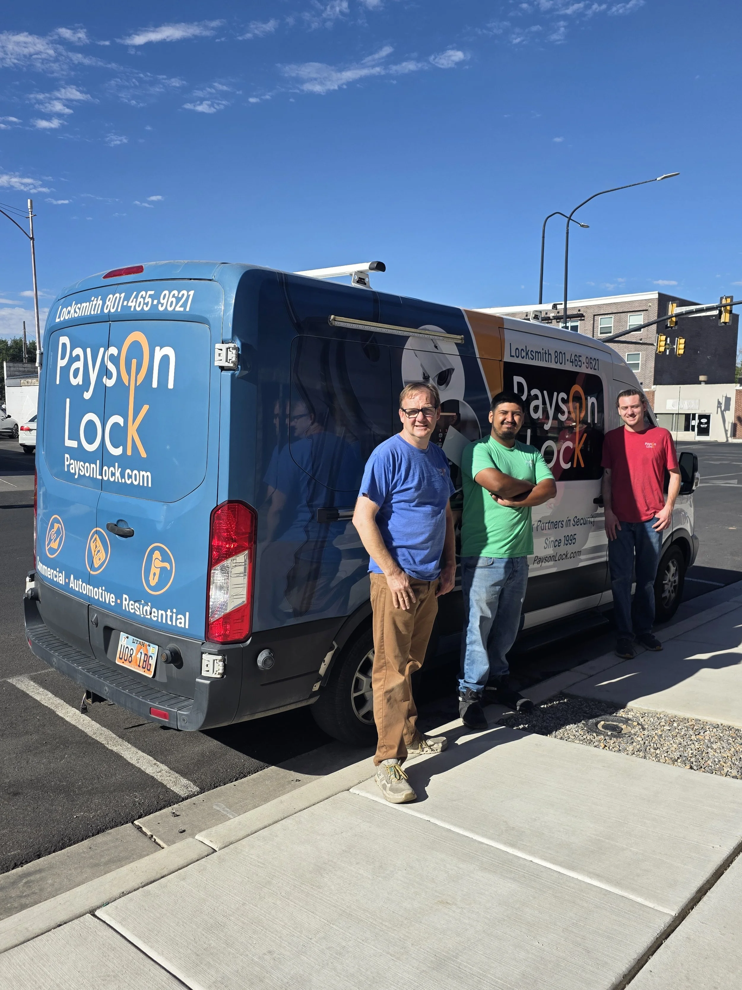 Payson Lock & Key locksmiths standing by the Payson Lock mobile vehicle.