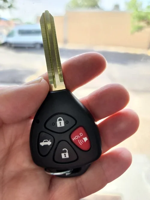 Someone holding a duplicate car key fob in their hand in Payson, Utah.