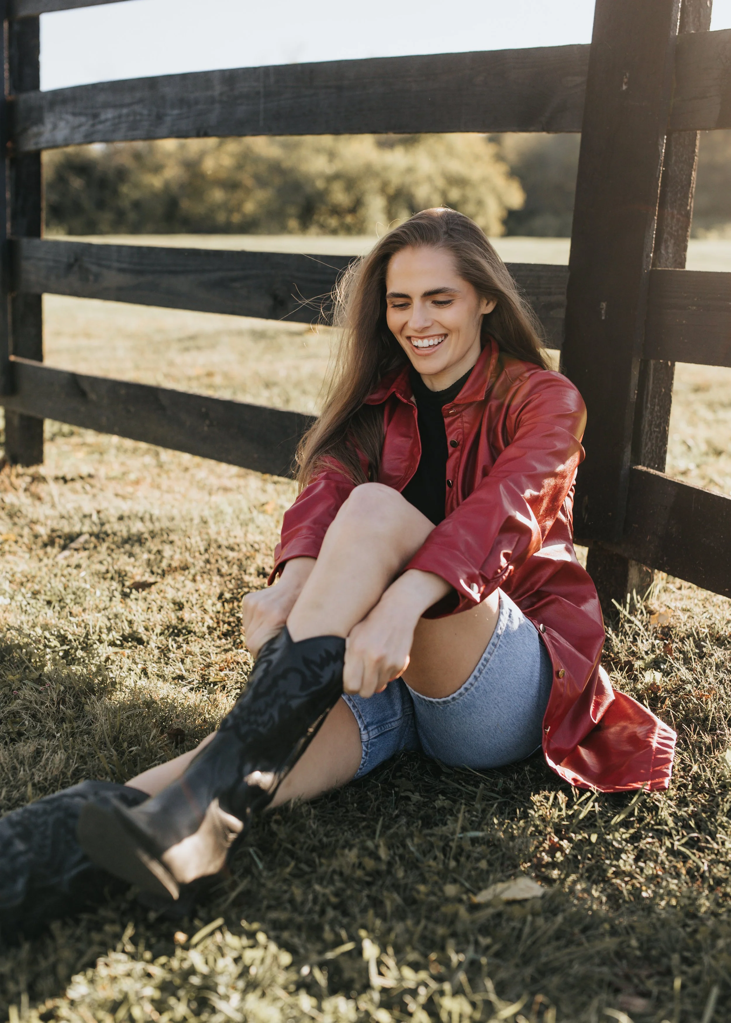  Model Skylar smiles while wearing a red jacket during her fashion photoshoot in Nashville. 
