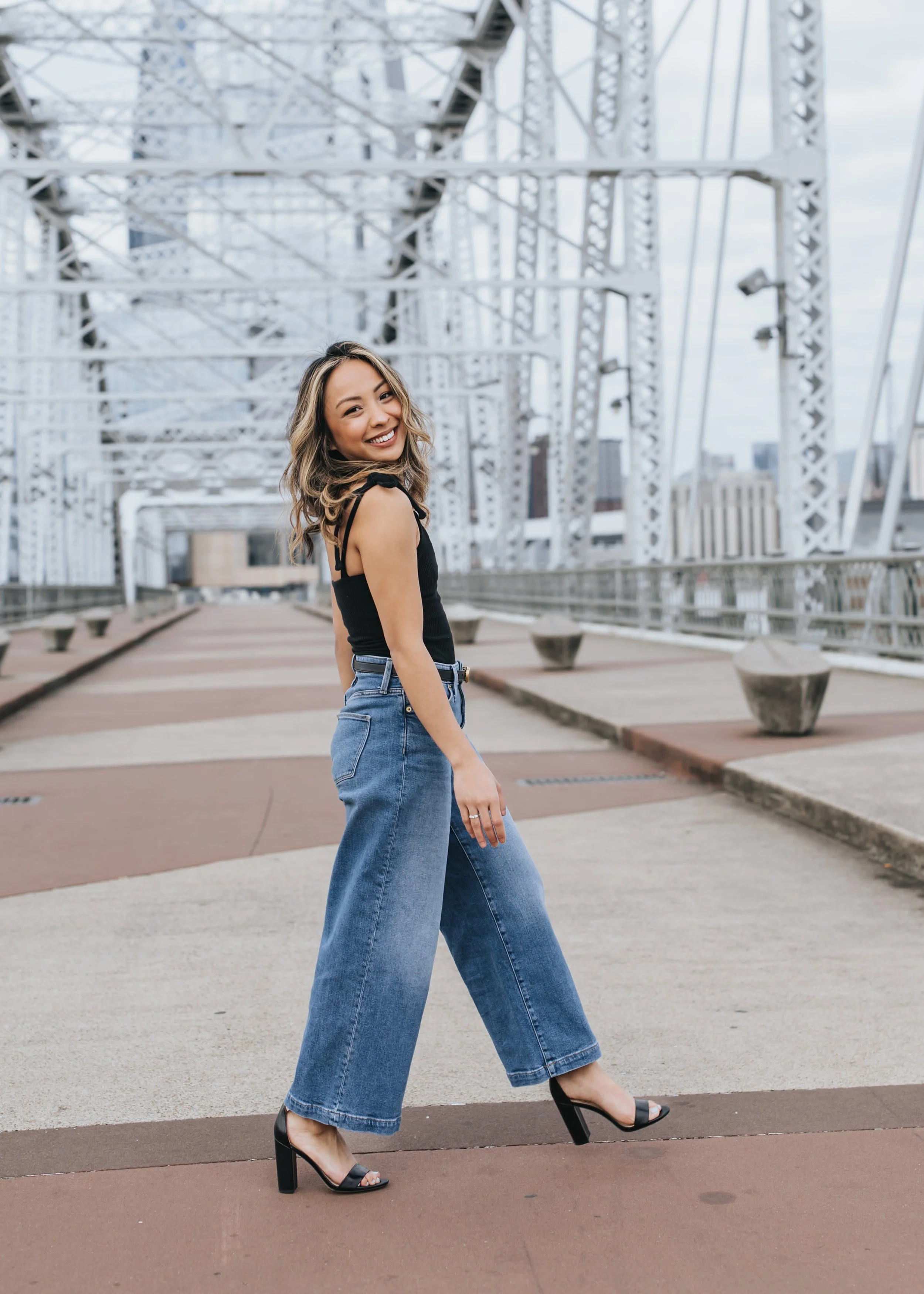  Kait posing for photos on the Pedestrian Bridge in Nashville 