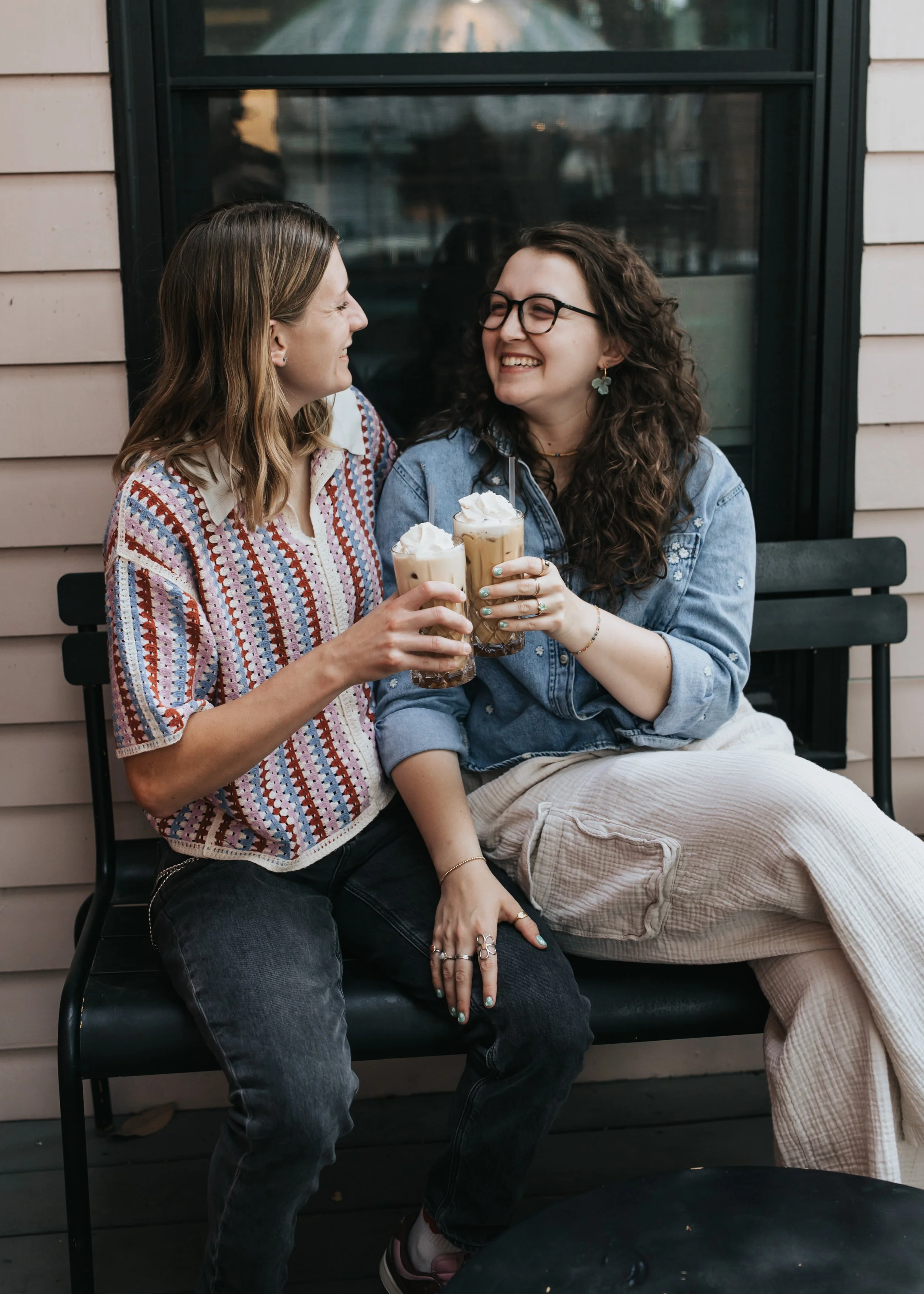  Maddie and Sarah photographed while sipping coffee during their LGBTQ+ engagement photoshoot in Nashville. 