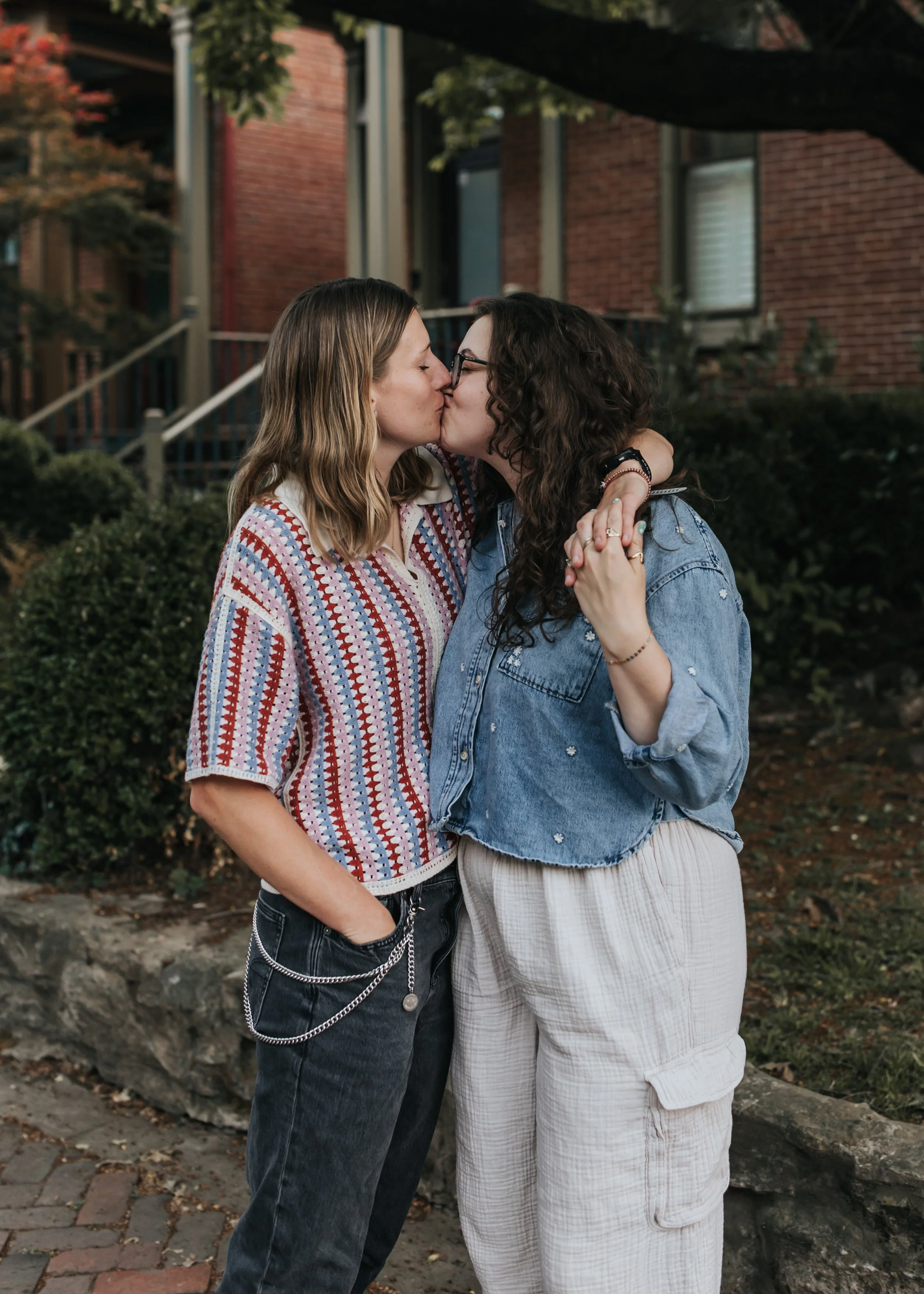  Maddie and Sarah photographed on the street in Germantown during their LGBTQ+ engagement photoshoot in Nashville. 