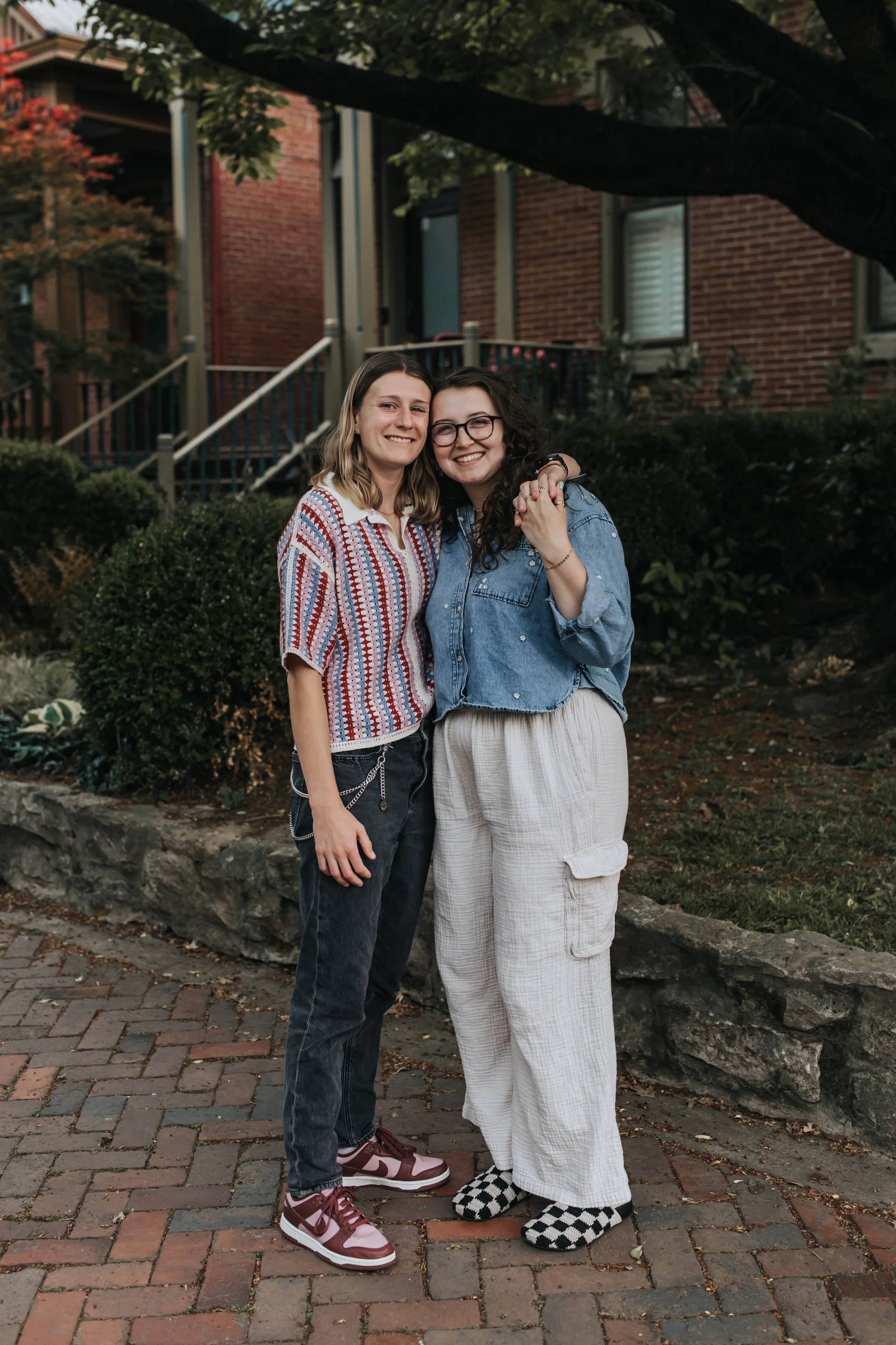  Maddie and Sarah photographed on the street in Germantown during their LGBTQ+ engagement photoshoot in Nashville. 