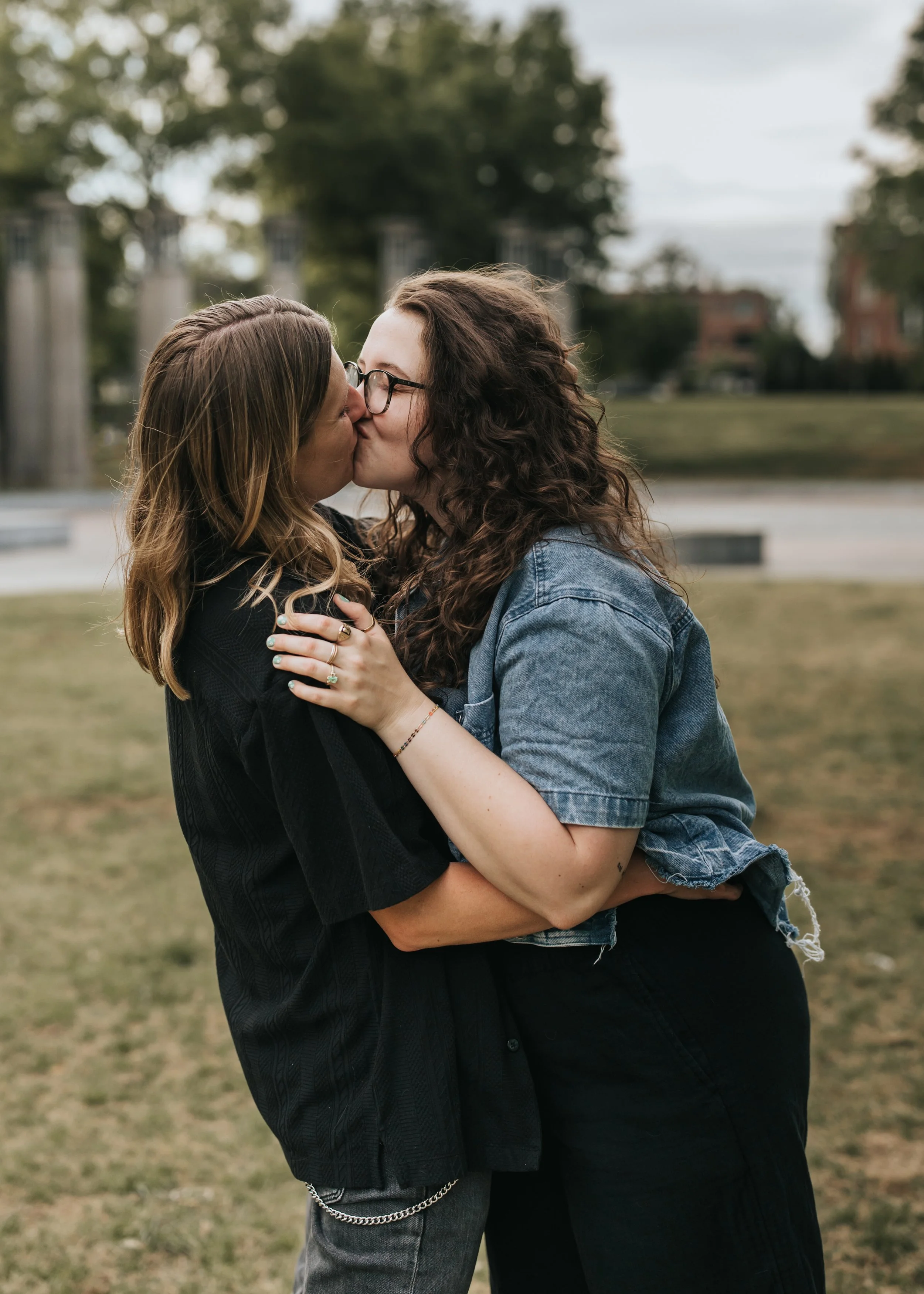  Maddie, Sarah, and their dog Bear at Bicentennial Park during their LGBTQ+ engagement photoshoot. 