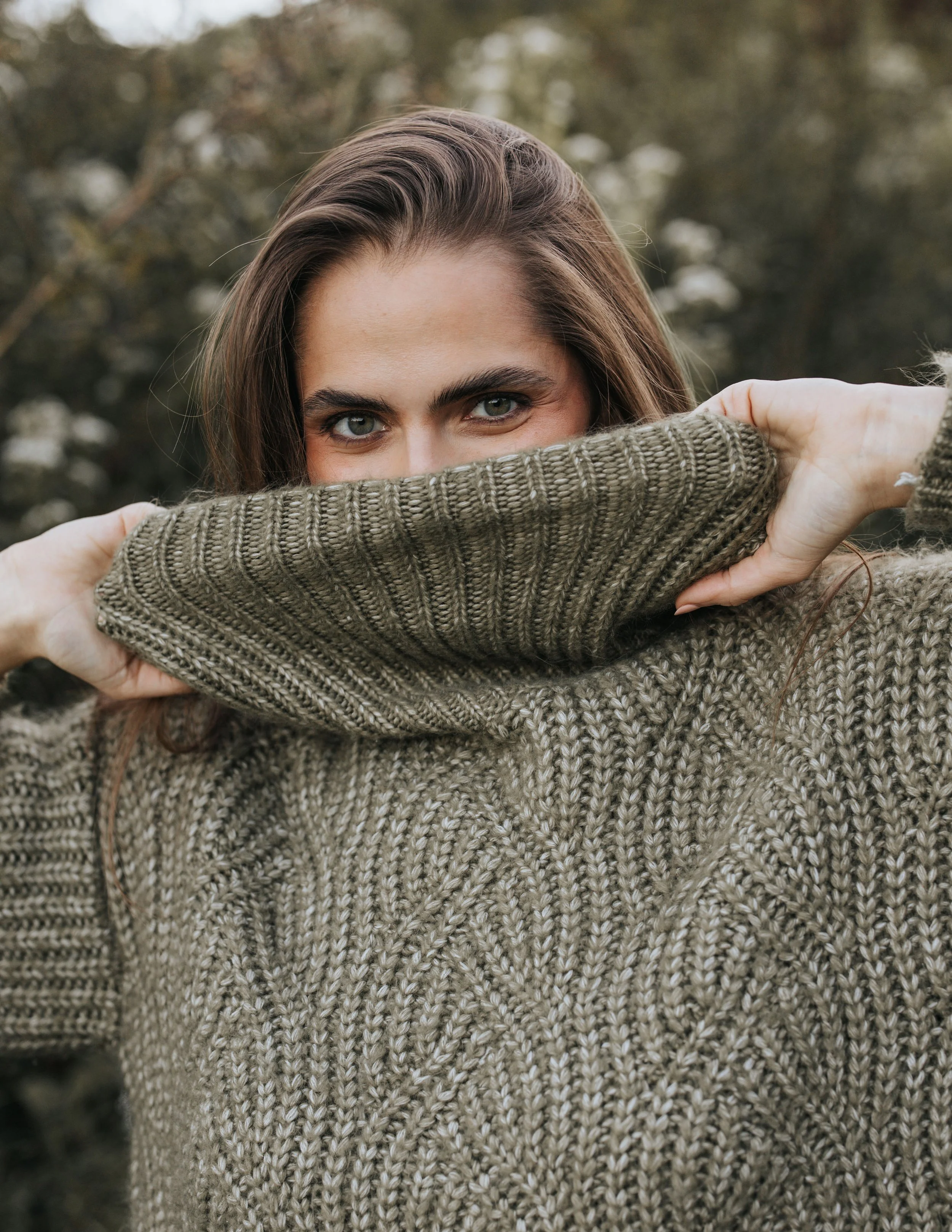  Model Skylar hides her face using a green sweater during her Nashville fashion photography test shoot. 