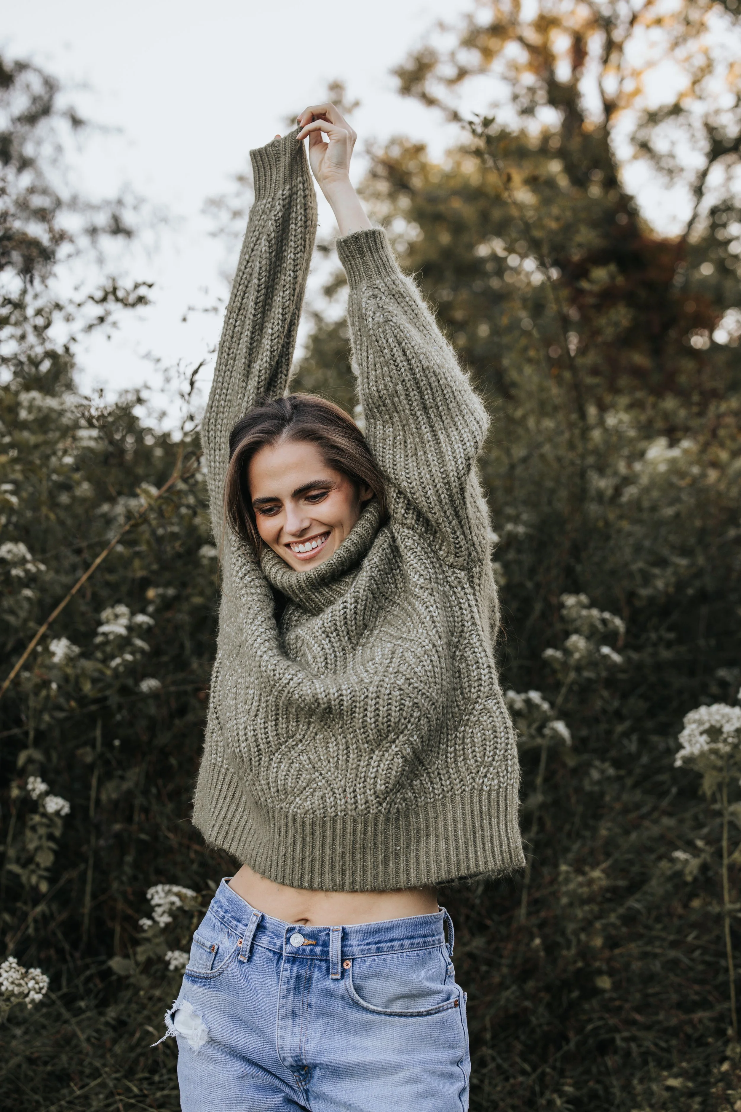  Model Skylar poses in a green sweater and denim shorts during her Nashville fashion photography test shoot. 