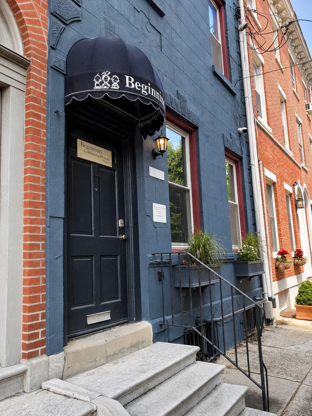 Entrance to a Beginnings Learning Center preschool building in a Philadelphia rowhome