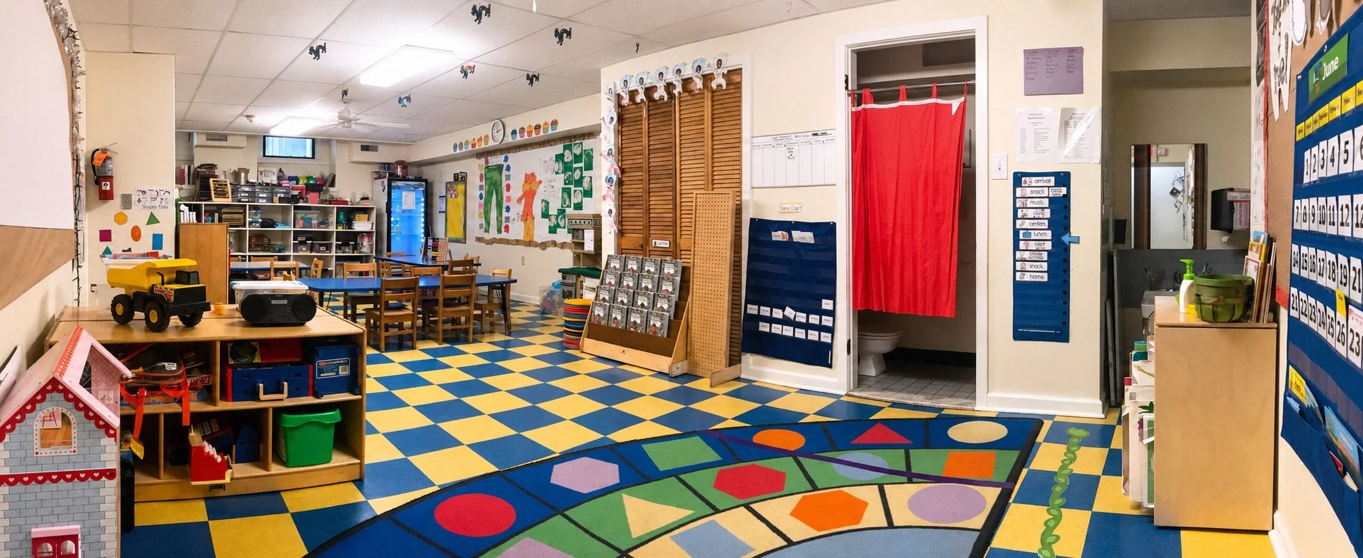 Colorful preschool classroom with learning centers and child-sized furniture at Beginnings Learning Center in Philadelphia