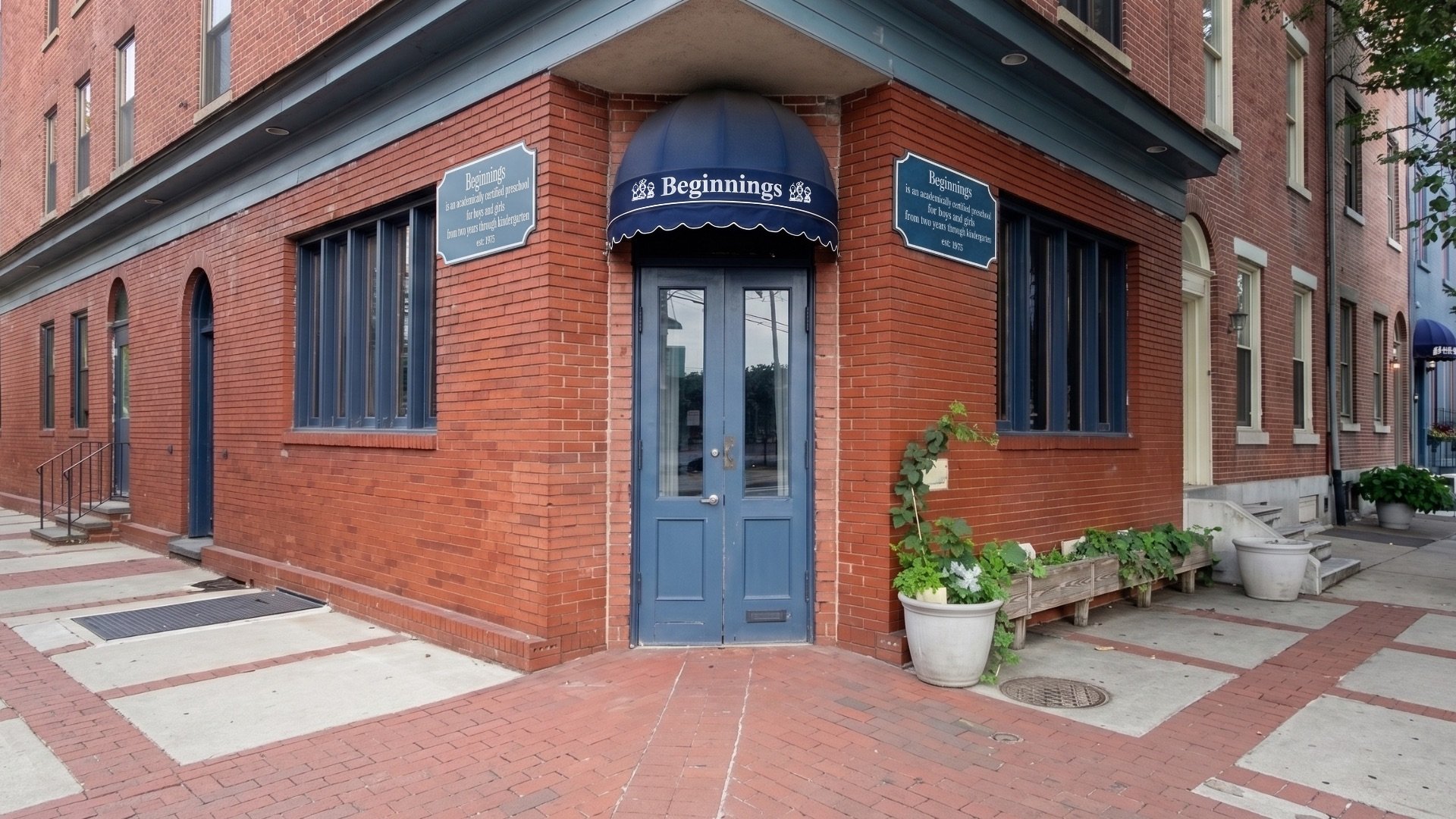 Brick exterior of Beginnings Learning Center preschool on a neighborhood corner in Philadelphia