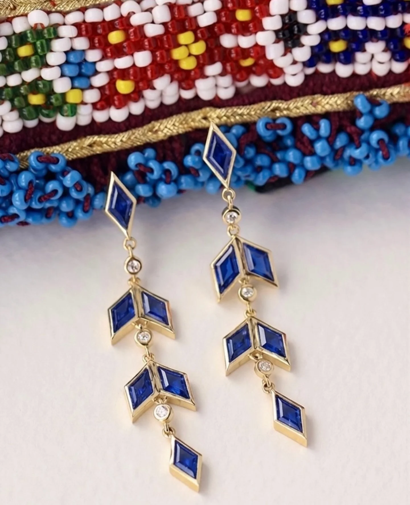 I designed our Zan dangle earrings as a love letter to Afghan women and a celebration of women everywhere.

The rhombus shape is a symbol of women, fertility, and creativity in Afghan and Central Asian design.&diams;️The rhombus is arranged singly an