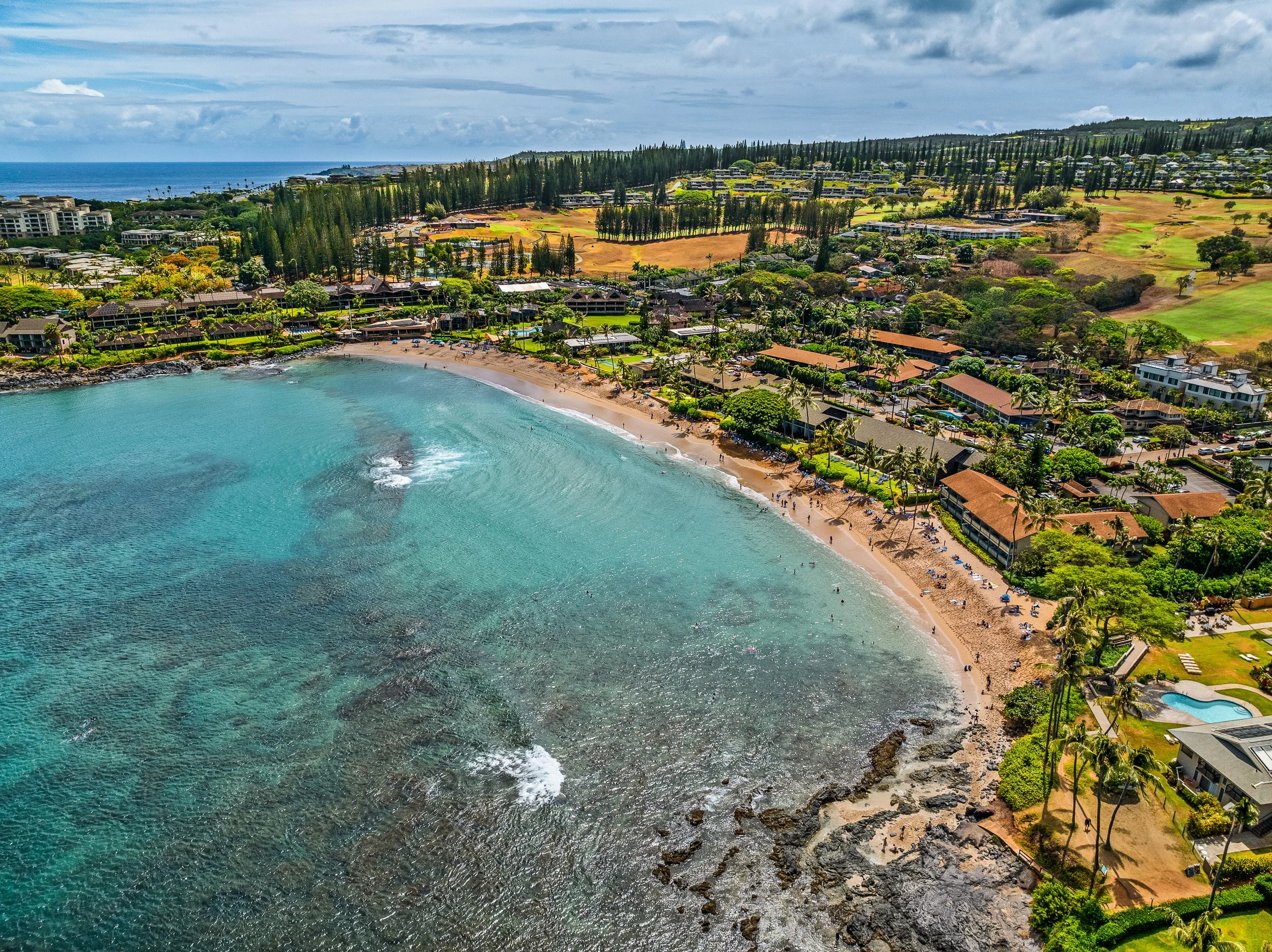  Napili Bay shoreline with white sand, clear water, and coral reef, near Maui resort rental property