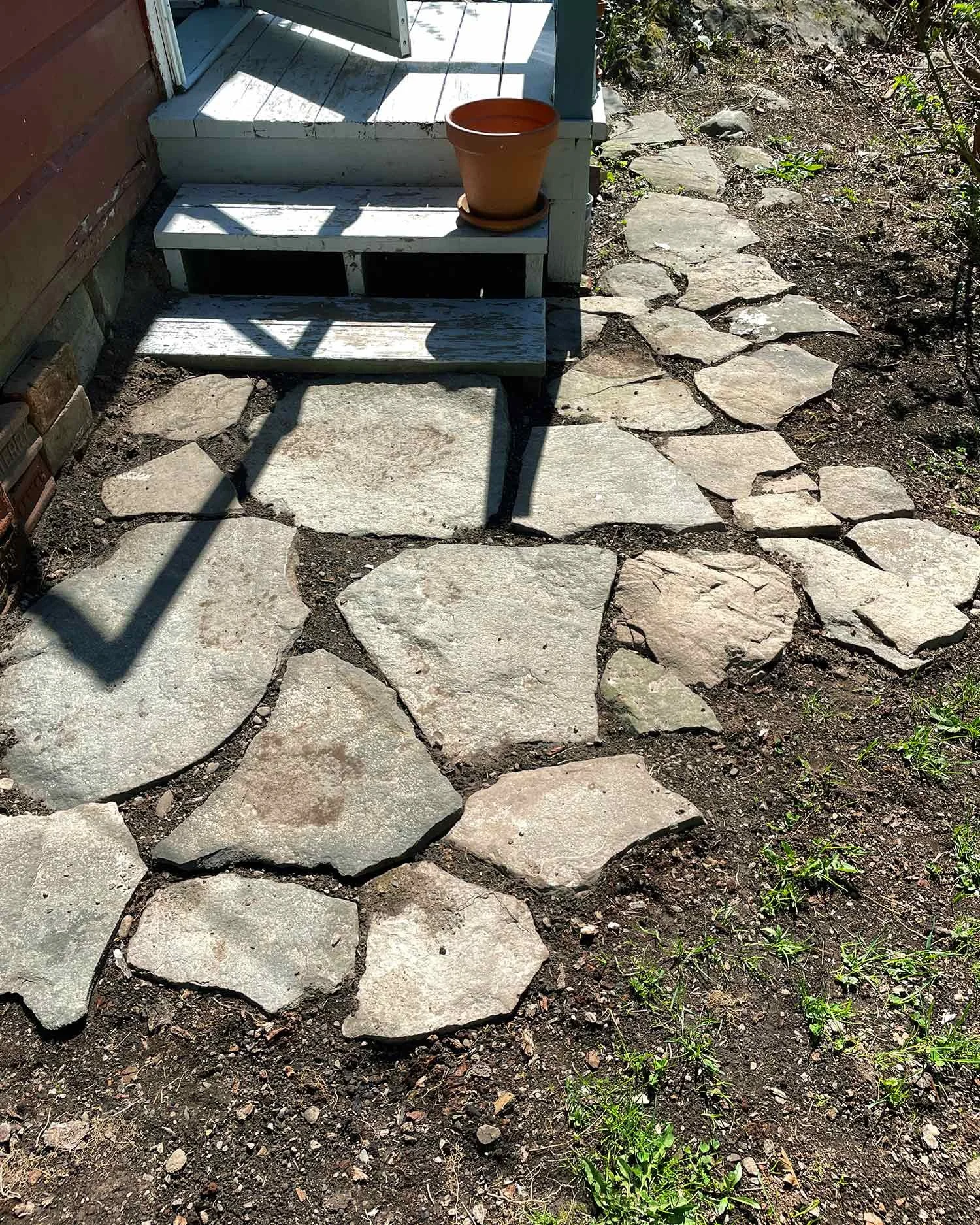 little-red-caboose-maverick-cabin-woodstock-rock-walkway.jpg