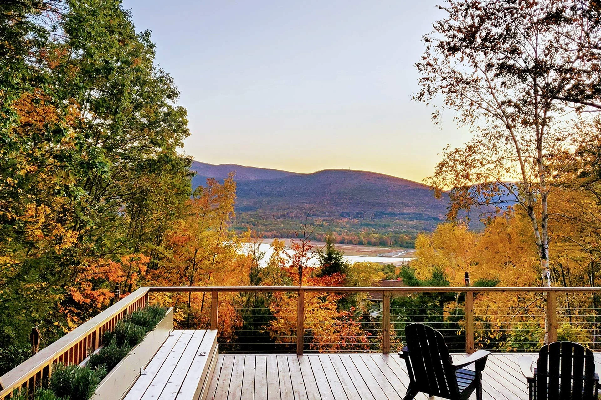 Stylish-mountain-house-reservoir-views-Autumn-deck-bench.jpg