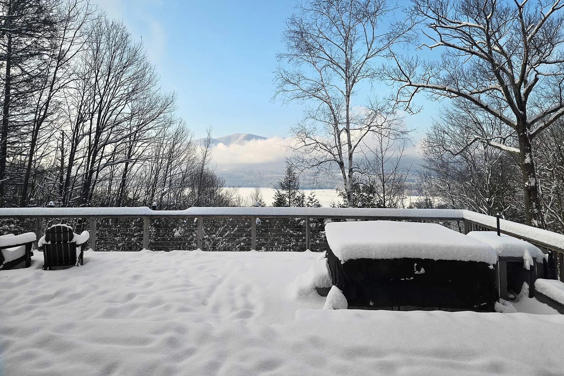 Stylish-mountain-house-reservoir-views-Winter-deck-snow.jpg