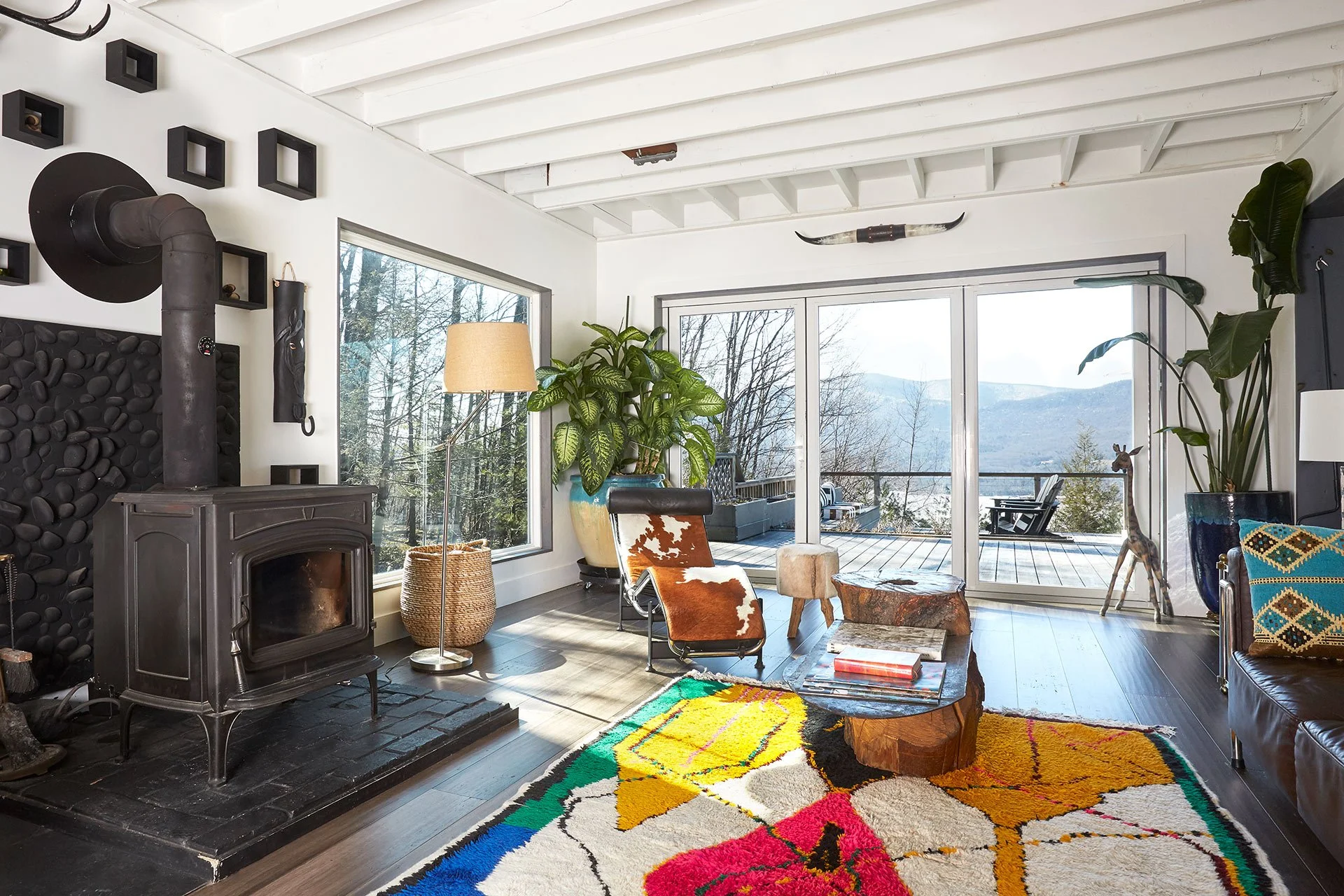 stylish-mountain-house-with-reservoir-views-livingroom-woodstove-mountainview.jpg