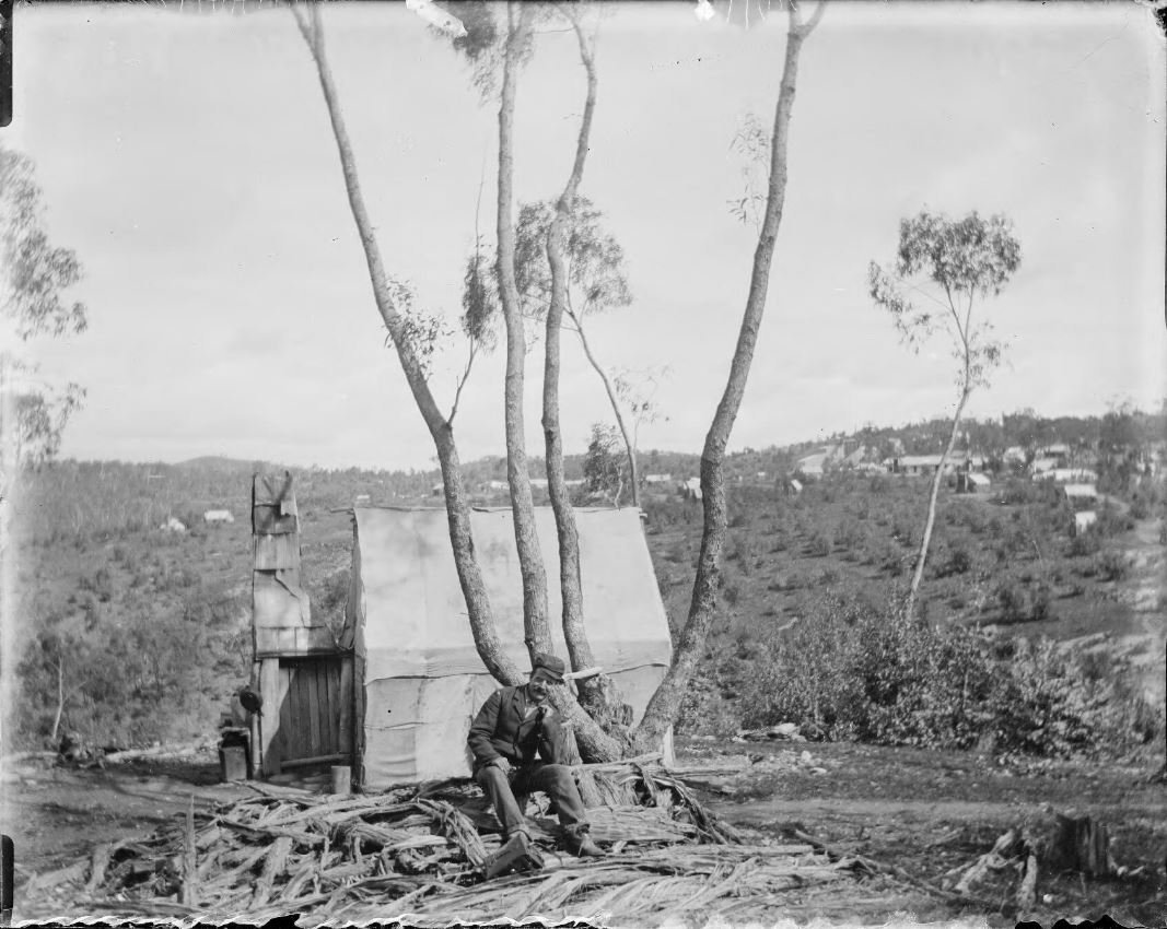 Gold miner sitting outside his hut at the gold diggings, Gundagai, New South Wales [picture] / Charles Gabriel