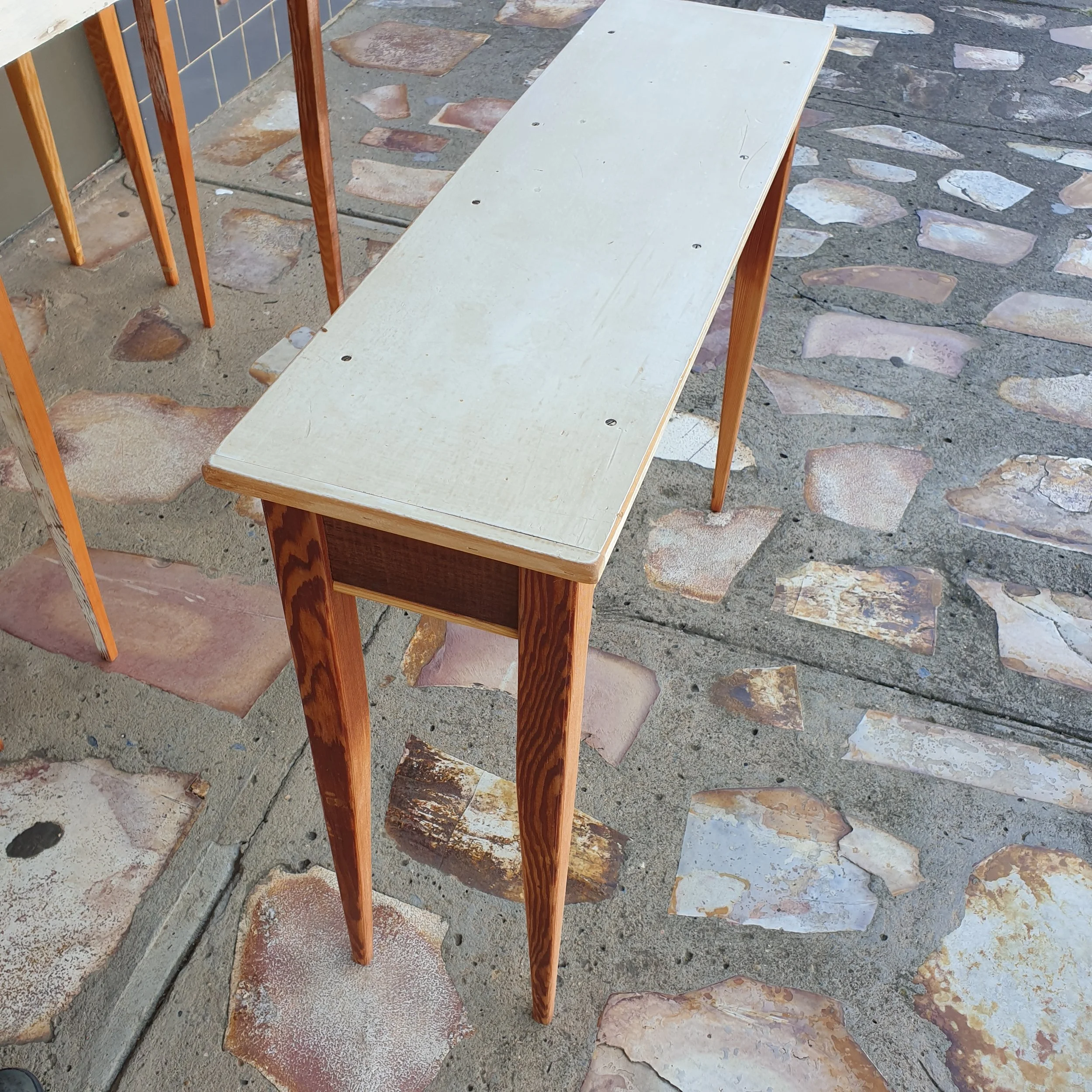 #963 hall table; white-painted top; fine-grained oregon legs; 760 h x 980 l x 280 w; $800