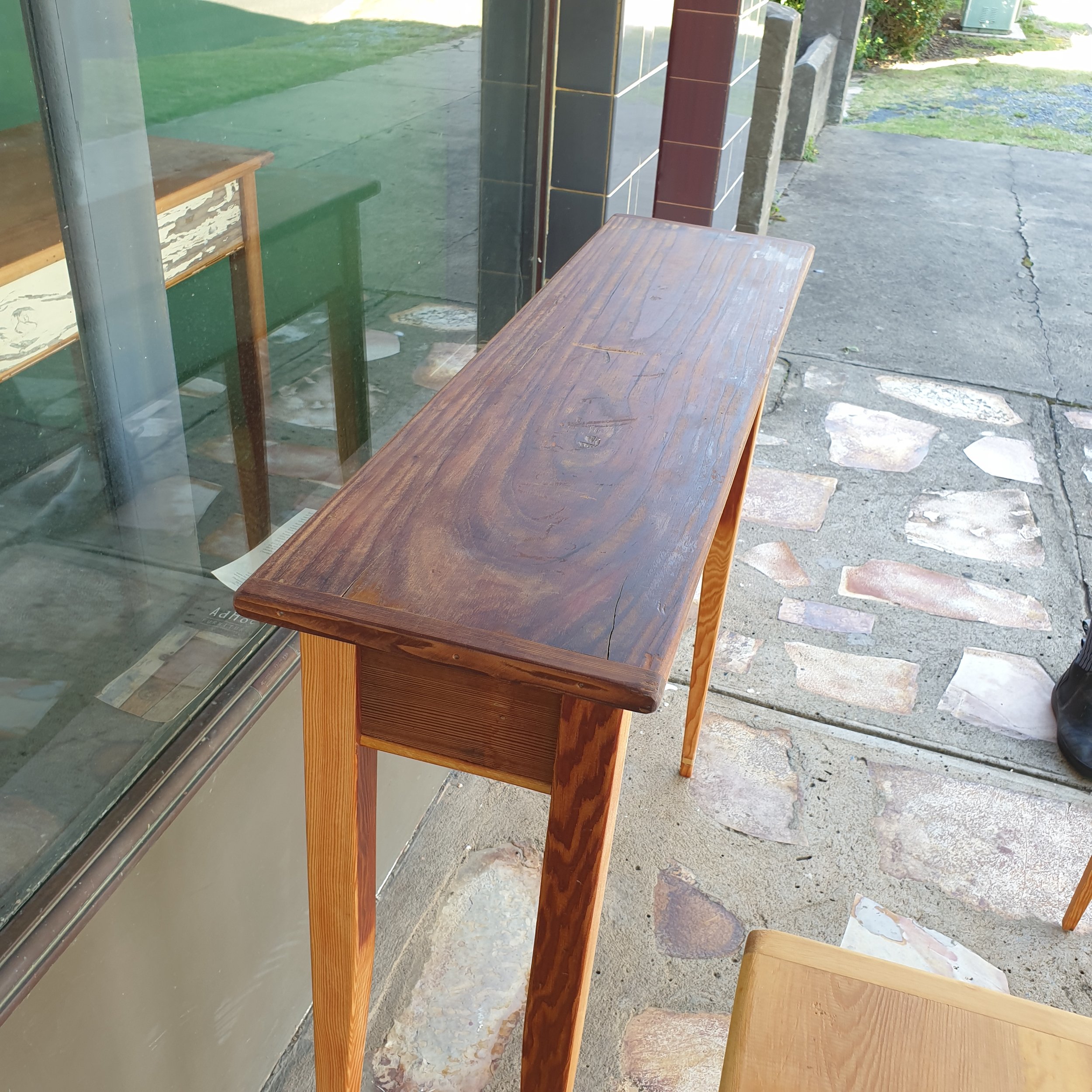 #962 hall table; redwood top; Australian cedar skirts; fine-grained oregon legs; 950 h x 1075 l x 290 w; $900