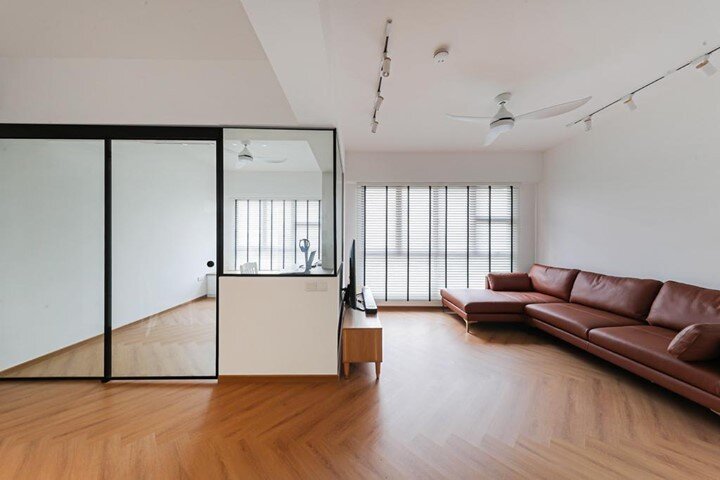 This bright and airy living room is designed to sport a minimal, clutter-free look with only the most functional furniture in place. With an emphasis on balancing functionality and simplistic beauty, a neutral colour palette is chosen and matched wit