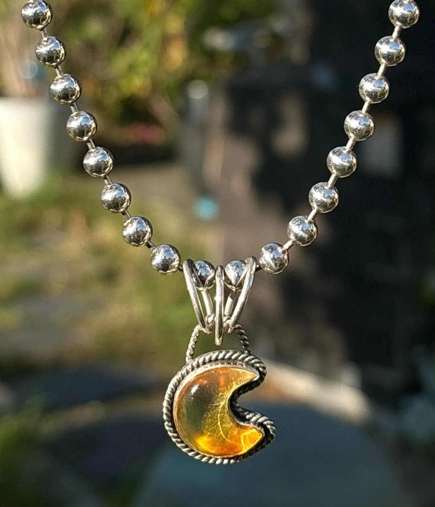 Visit the gallery to discover our wide array of handmade pendants and sterling silver chains of all styles⛓️🌙

Featuring this gorgeous amber crescent moon pendant by local artist, Megan Hood. Paired with a classic ball-chain. 💫🖤 @studiofondof 

Po