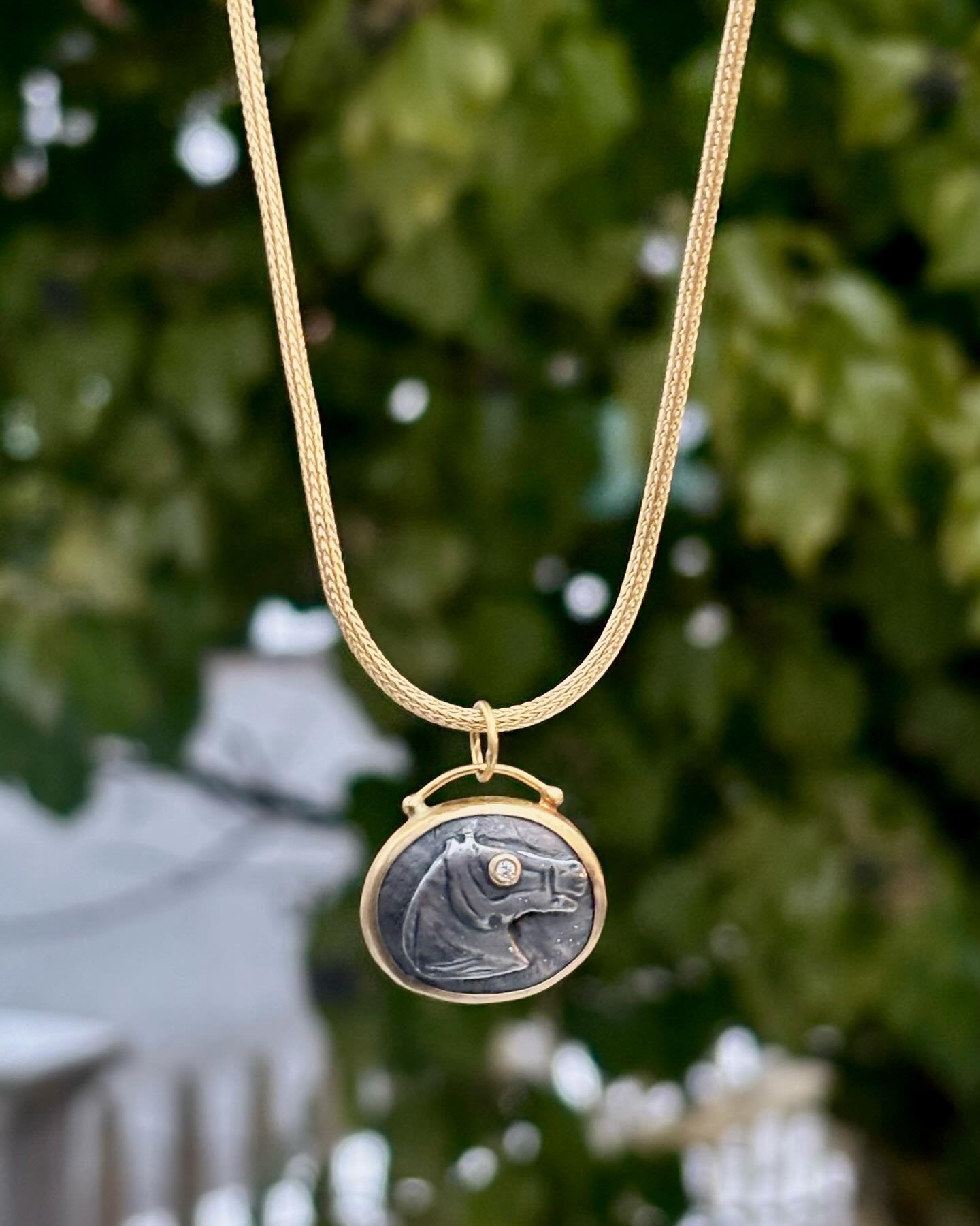 Did you know that 2026 is the year of the horse?!✨🐴

Adorn your neck with this little lucky horse pendant by Prehistoric Works! 24k gold &amp; oxidized silver with a diamond eye. Shown on a wheat chain. ✨🩶

Stop by the gallery to try it on! We&rsqu