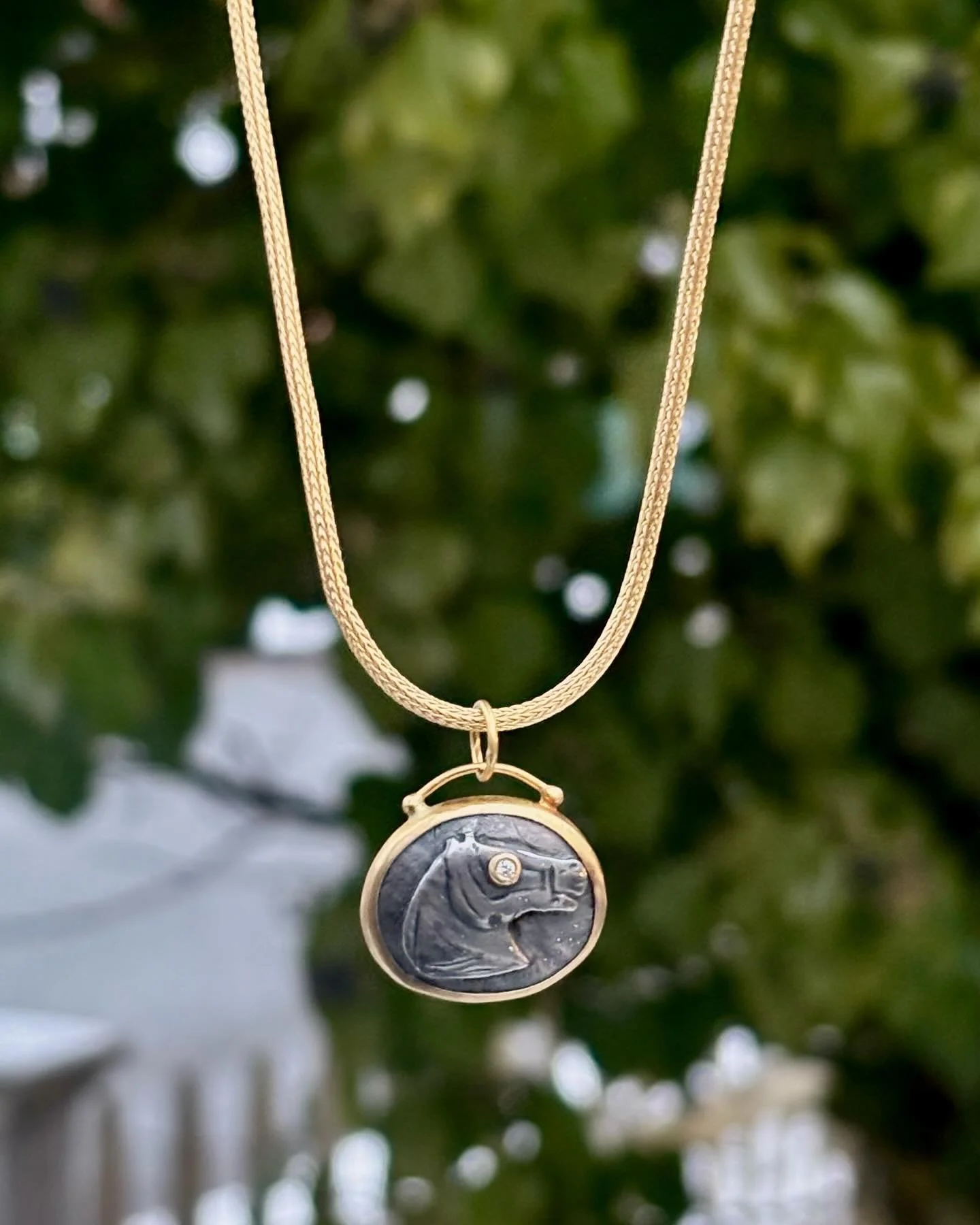 Did you know that 2026 is the year of the horse?!✨🐴

Adorn your neck with this little lucky horse pendant by Prehistoric Works! 24k gold &amp; oxidized silver with a diamond eye. Shown on a wheat chain. ✨🩶

Stop by the gallery to try it on! We&rsqu