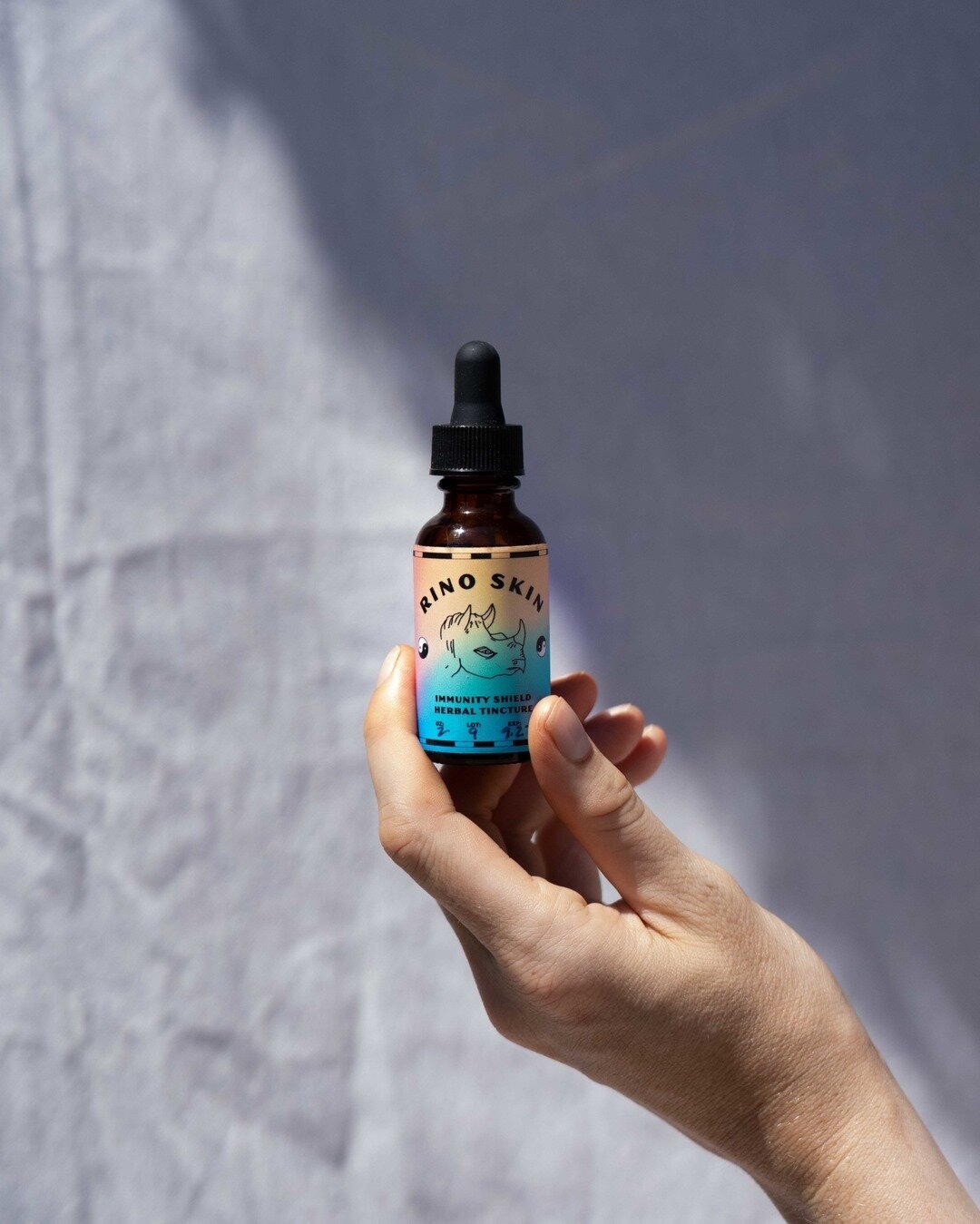 // Rino Skin Immunity Shield Herbal Tincture &mdash; fun gradients and illustrations for this label packaging design. I just listened to an amazing story about the last two Northern White Rhinos from @nytmag on @nytdaily. It's a sweet story worth an 