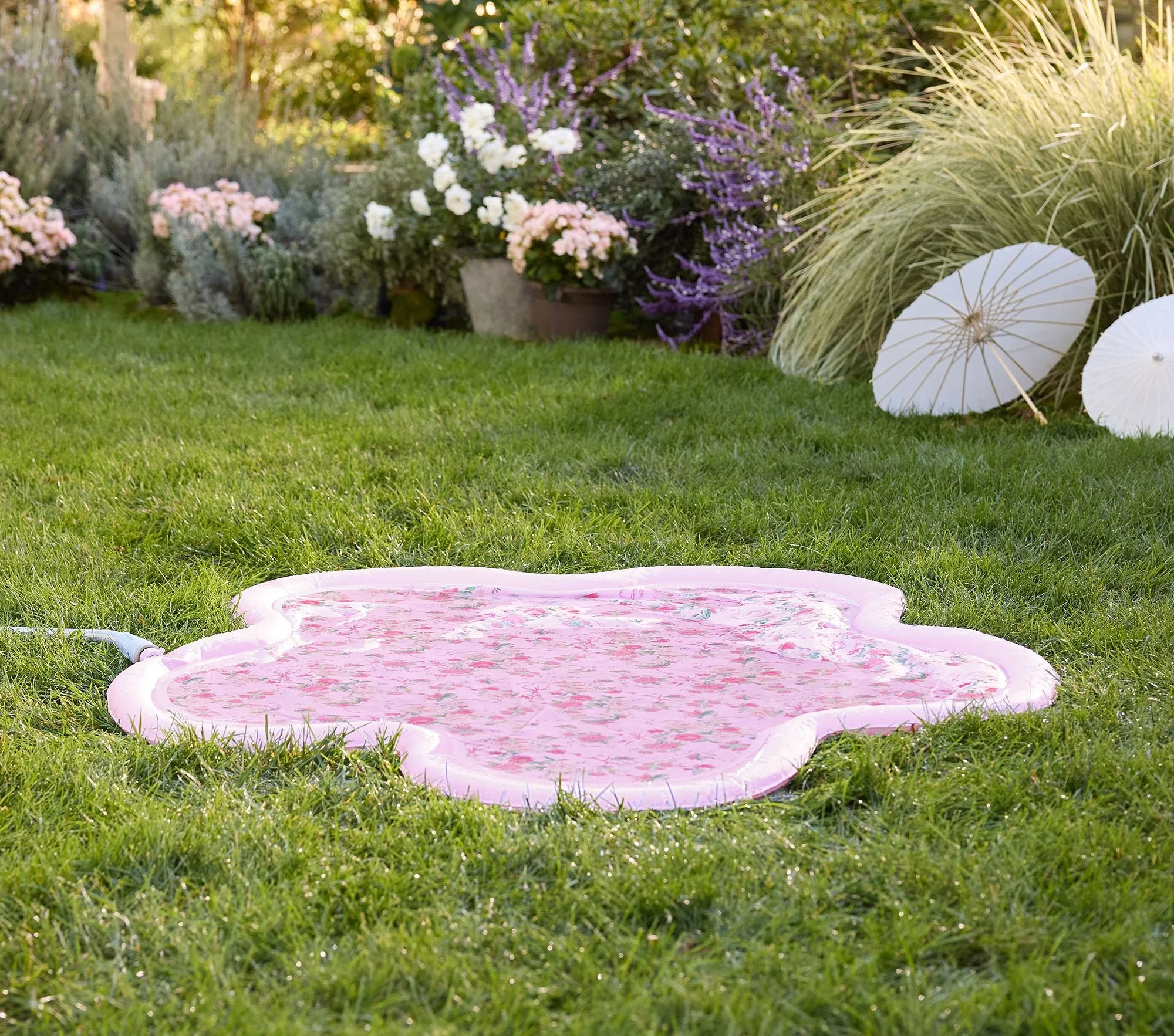 loveshackfancy-flower-shaped-inflatable-splash-pad-1-xl (1).jpg