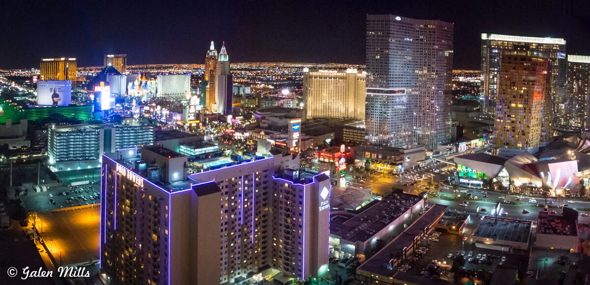 Las Vegas Strip at night with illuminated hotels and casinos, including MGM Grand and other notable buildings.