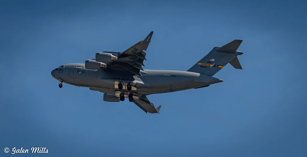 US Air Force C-17 Globemaster III in flight against a blue sky