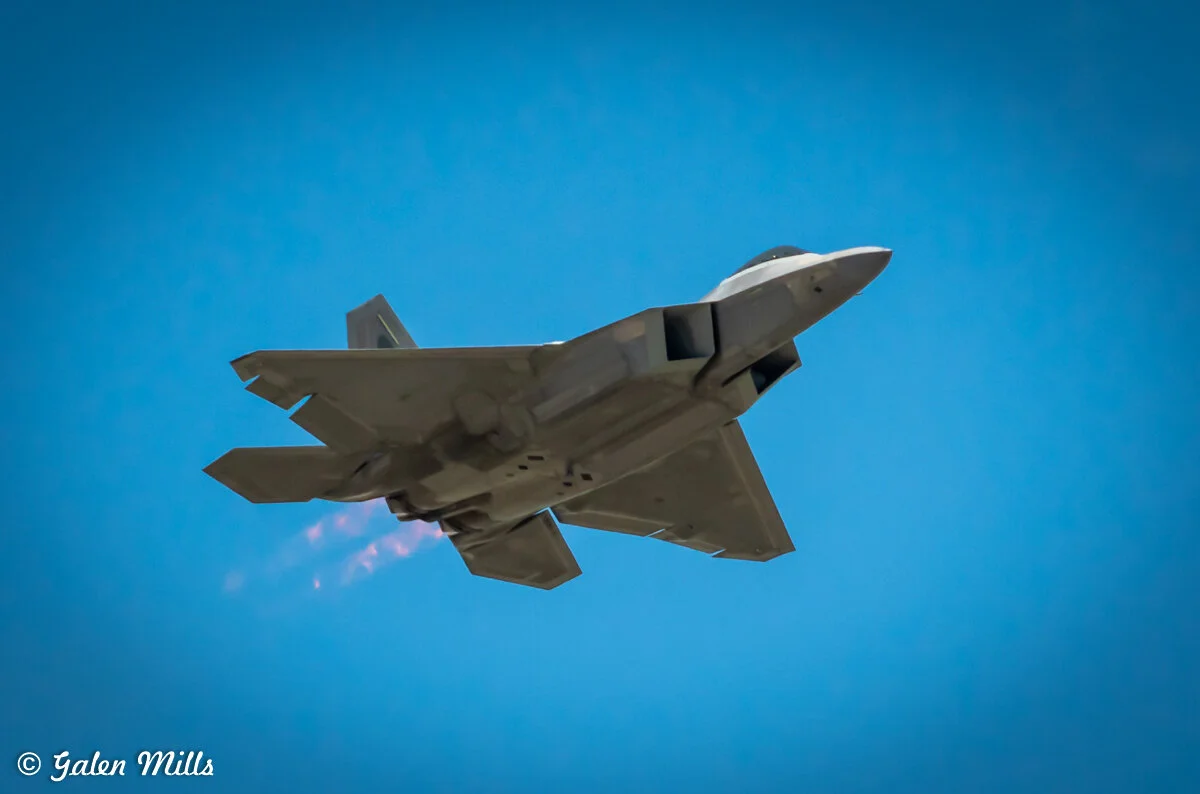 Fighter jet flying against clear blue sky
