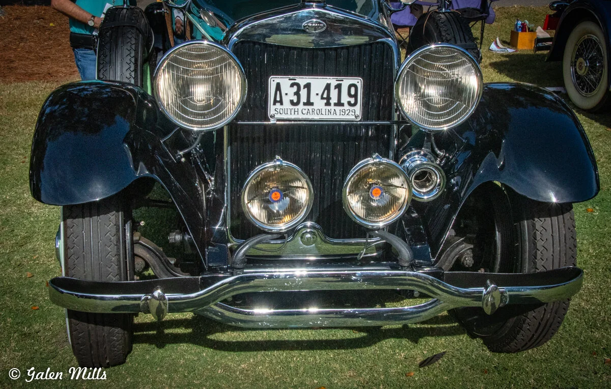 Front view of a vintage 1929 car with a South Carolina license plate, featuring prominent headlights and chrome details.