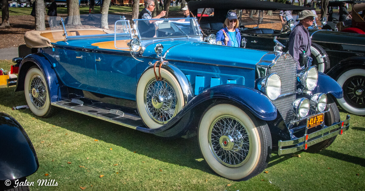 Vintage blue convertible car on display outdoors