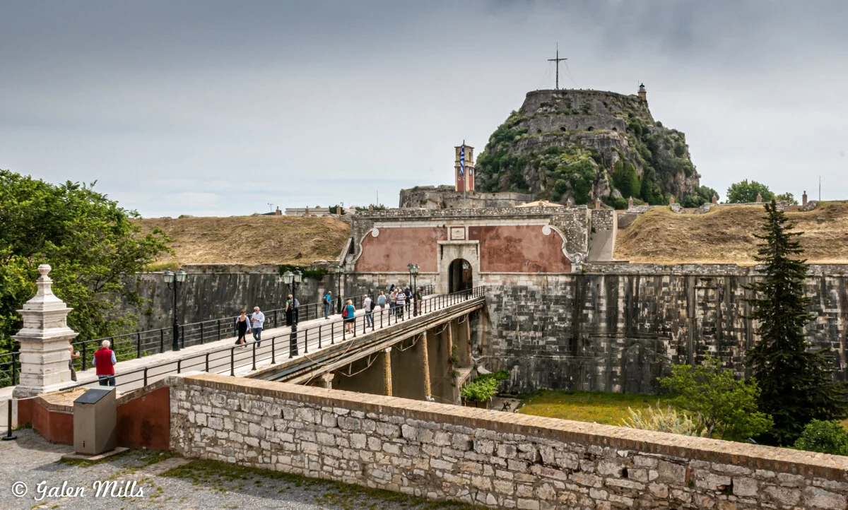 Tourists on bridge near Old Fortress in Corfu, Greece